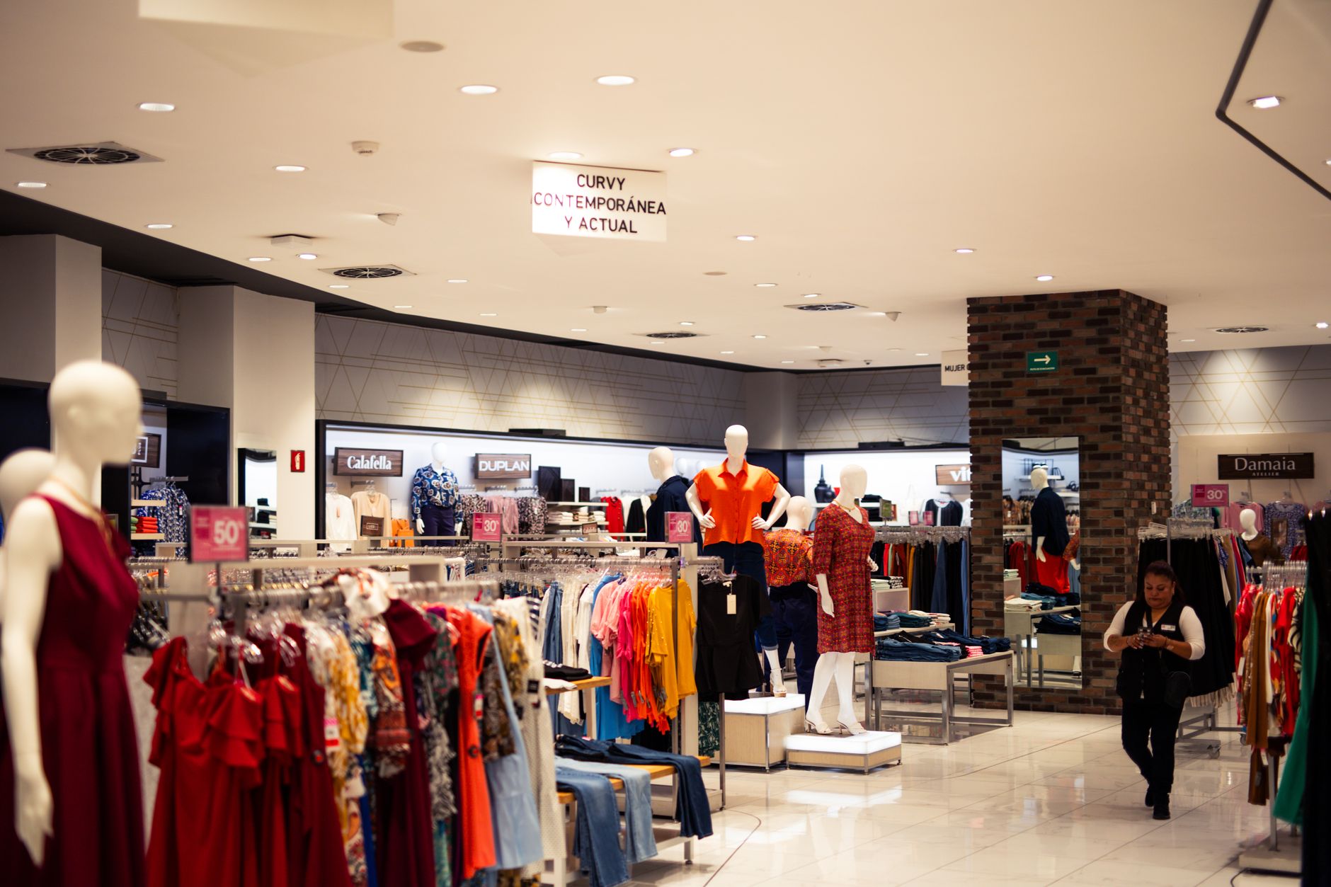 Bustling fashion boutique showcasing contemporary clothing and accessories.
