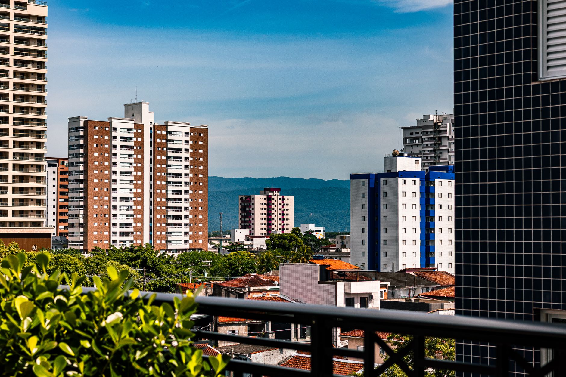 Beautiful urban skyline featuring high-rise buildings against a clear blue sky.