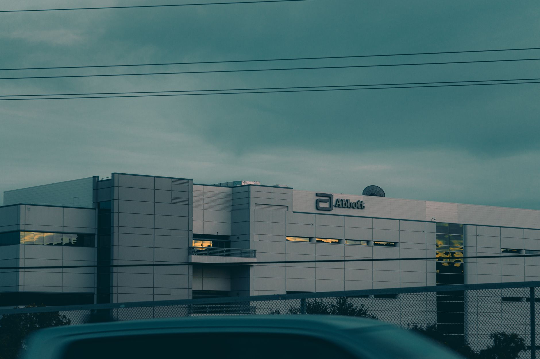 A modern building in Temecula, CA, under a gloomy sky, showcasing contemporary architecture.