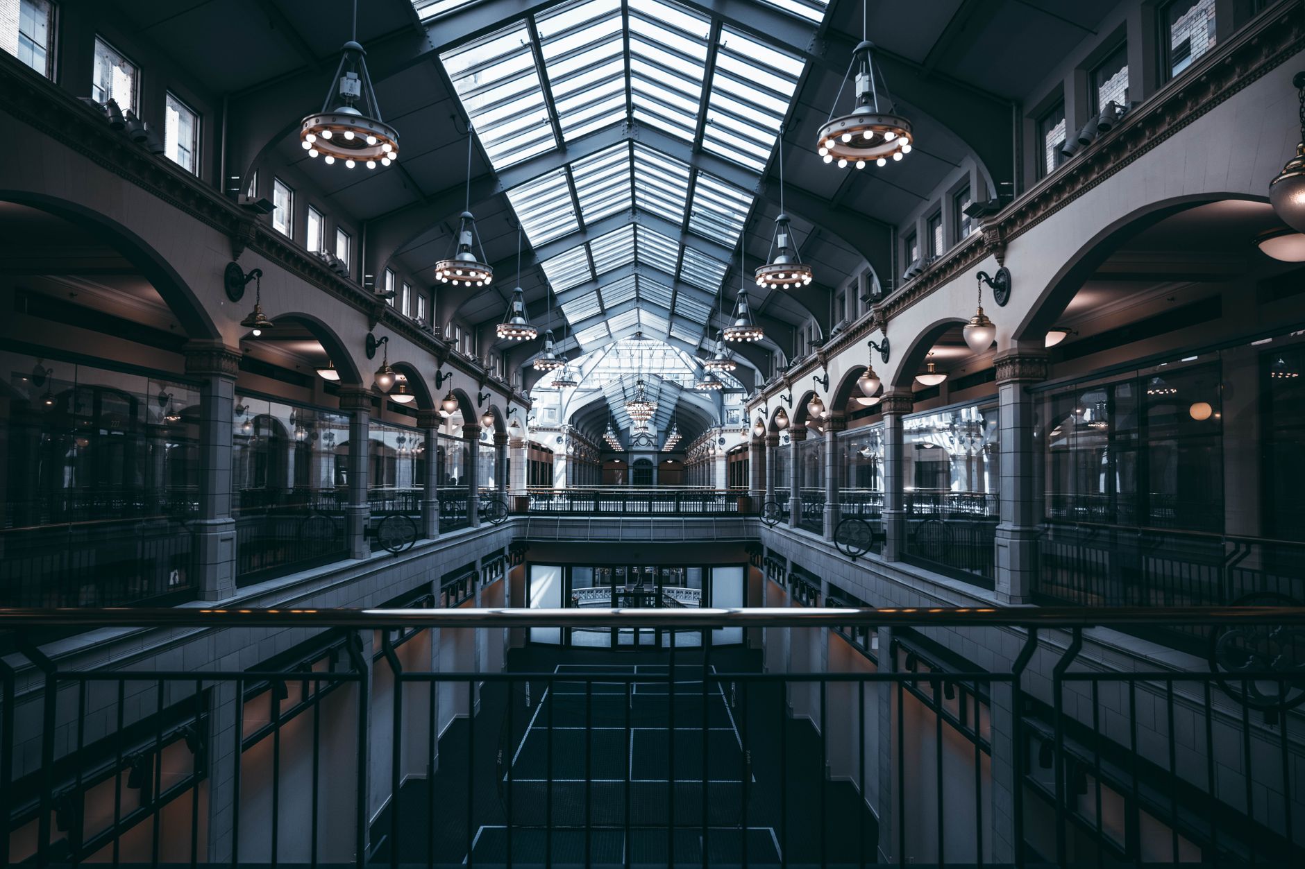 A stunning view of Milwaukee's historic architectural interior featuring grand arches and glass ceilings.