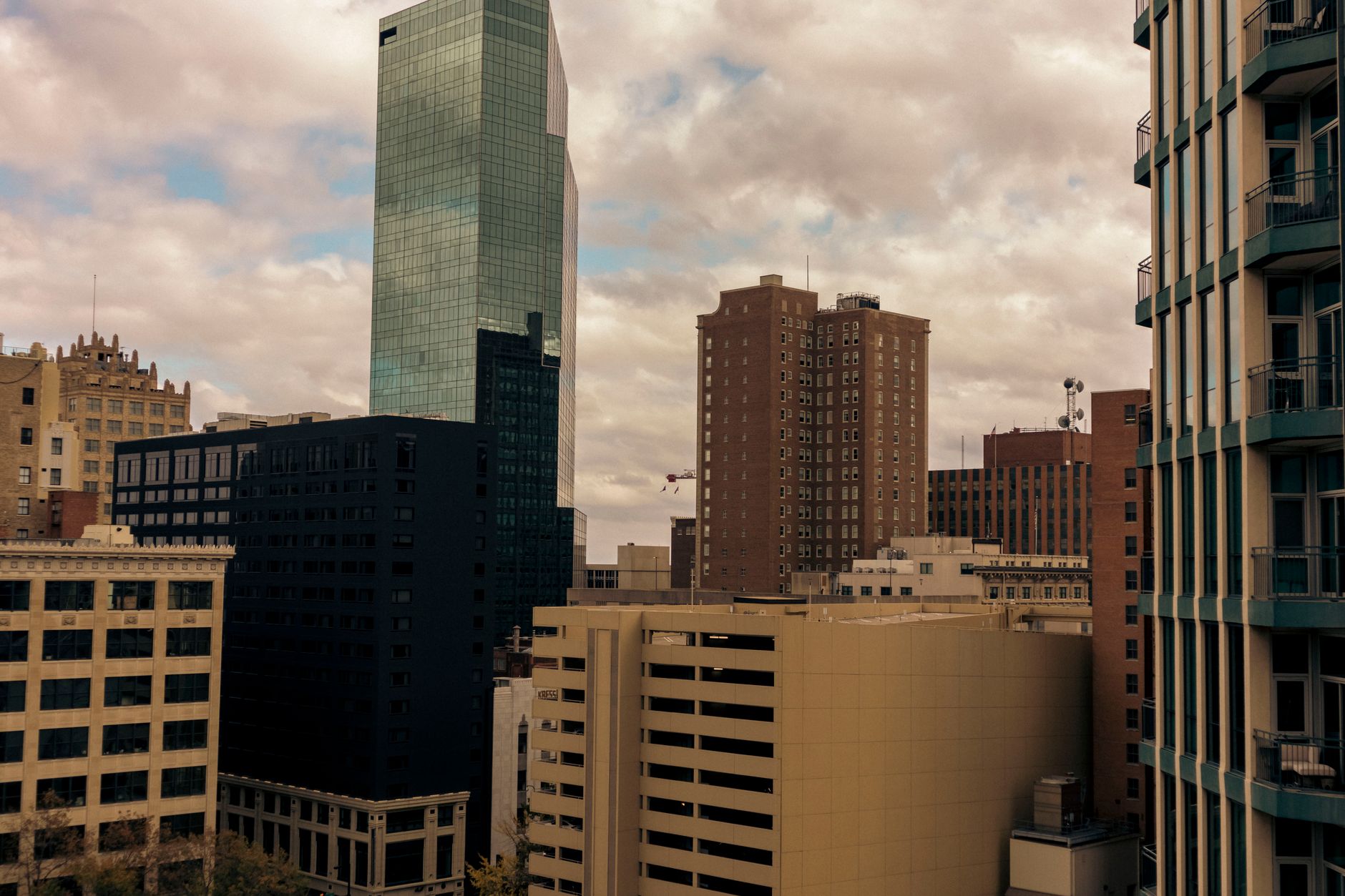 Dynamic urban skyline of Fort Worth, Texas, featuring prominent skyscrapers under cloudy skies.