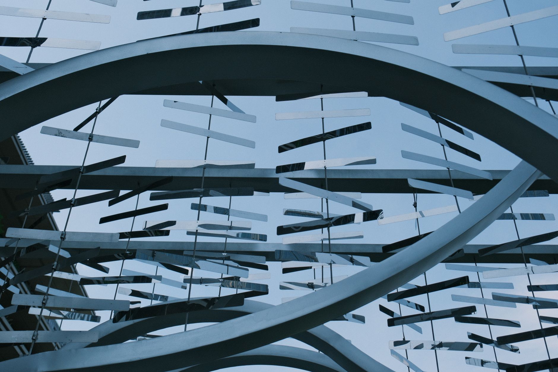 Abstract view of modern architectural structure with geometric forms and circular designs.