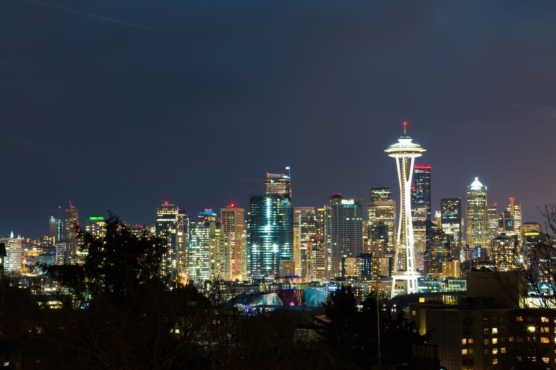Stunning view of Seattle's illuminated skyline with the iconic Space Needle at night.