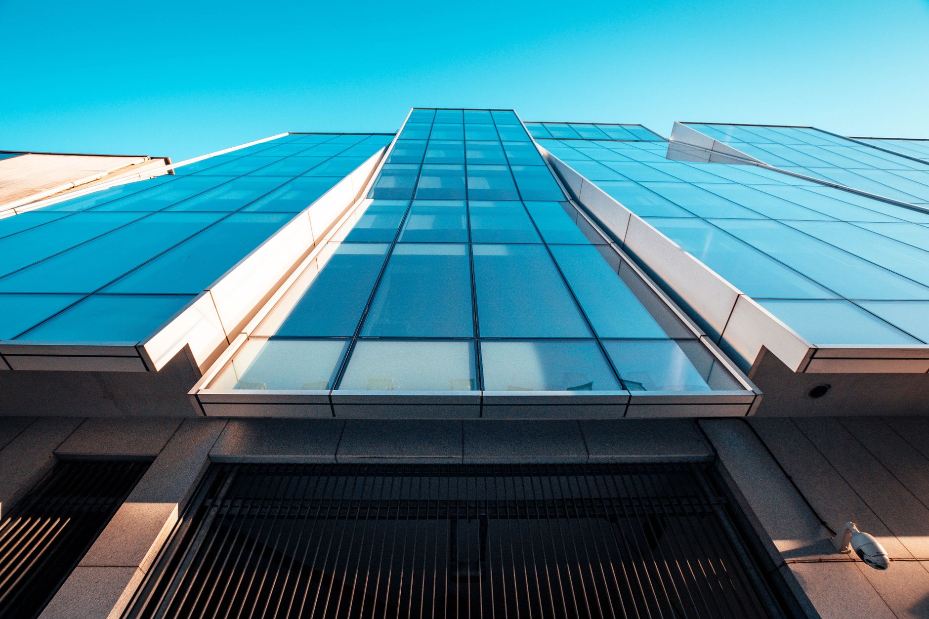 Low angle view of a modern office building with a glass facade in Dublin, Ireland.