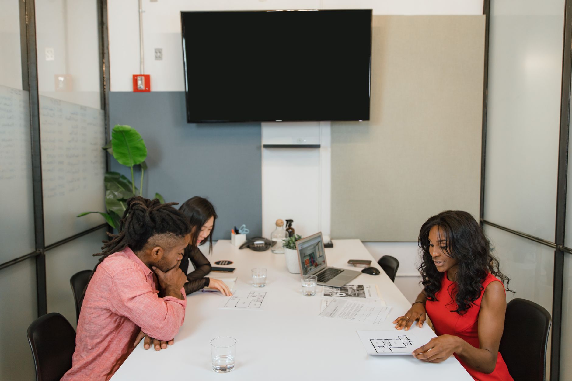 Business professionals having a meeting in a modern office space.