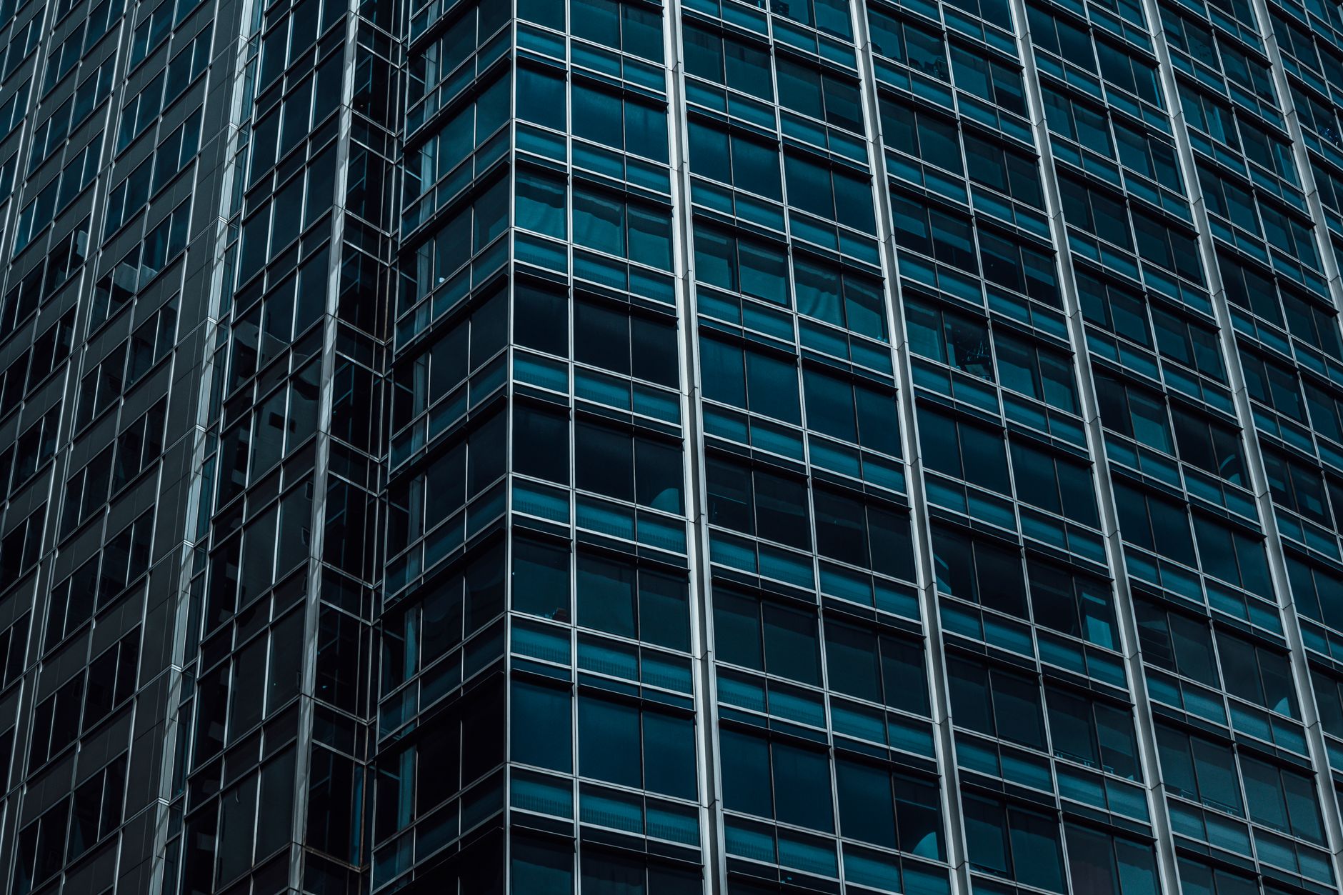 Detailed close-up of a modern skyscraper facade highlighting glass architecture.