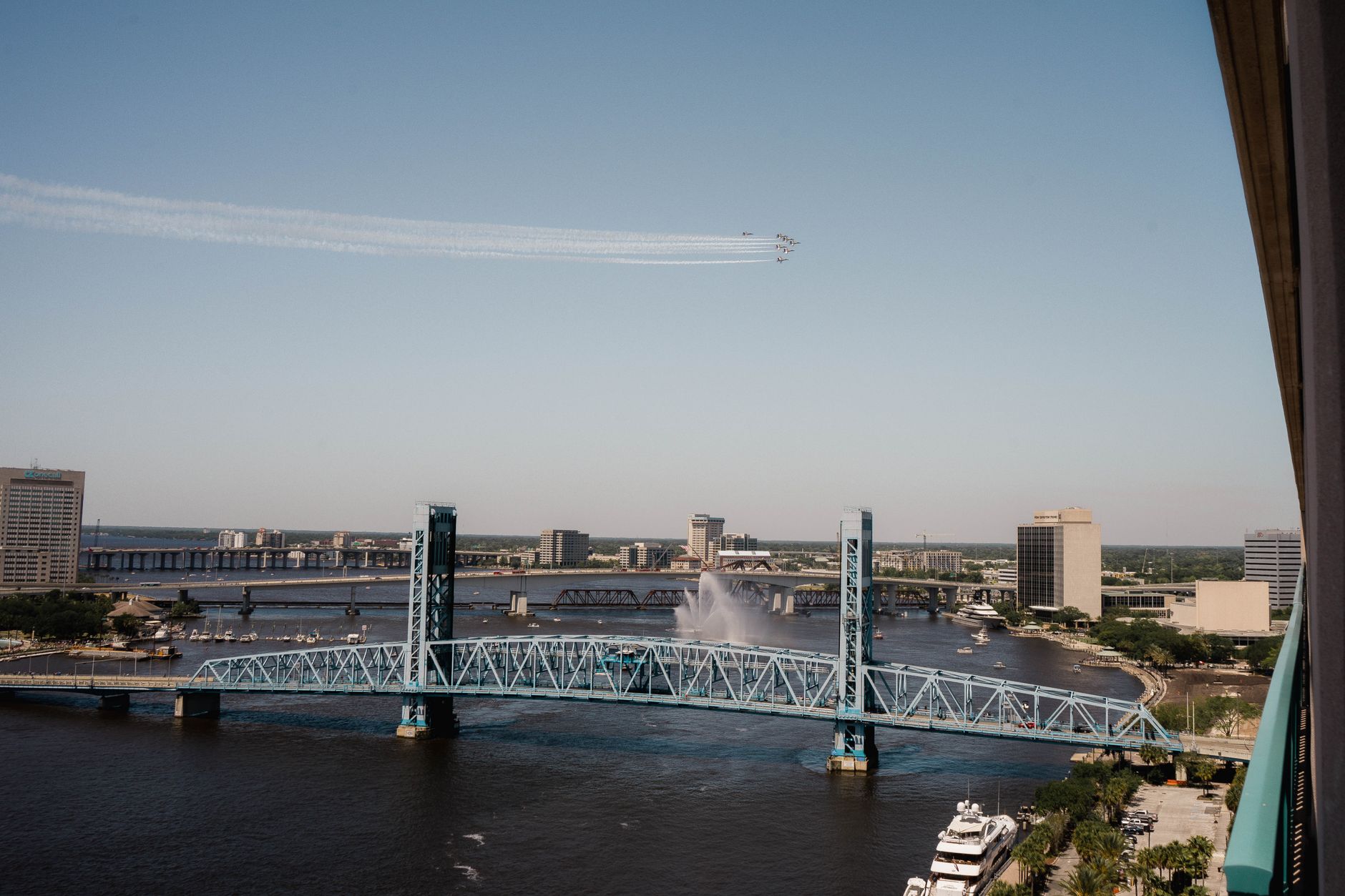A scenic view of Jacksonville's Main Street Bridge with blue skies and city skyline.
