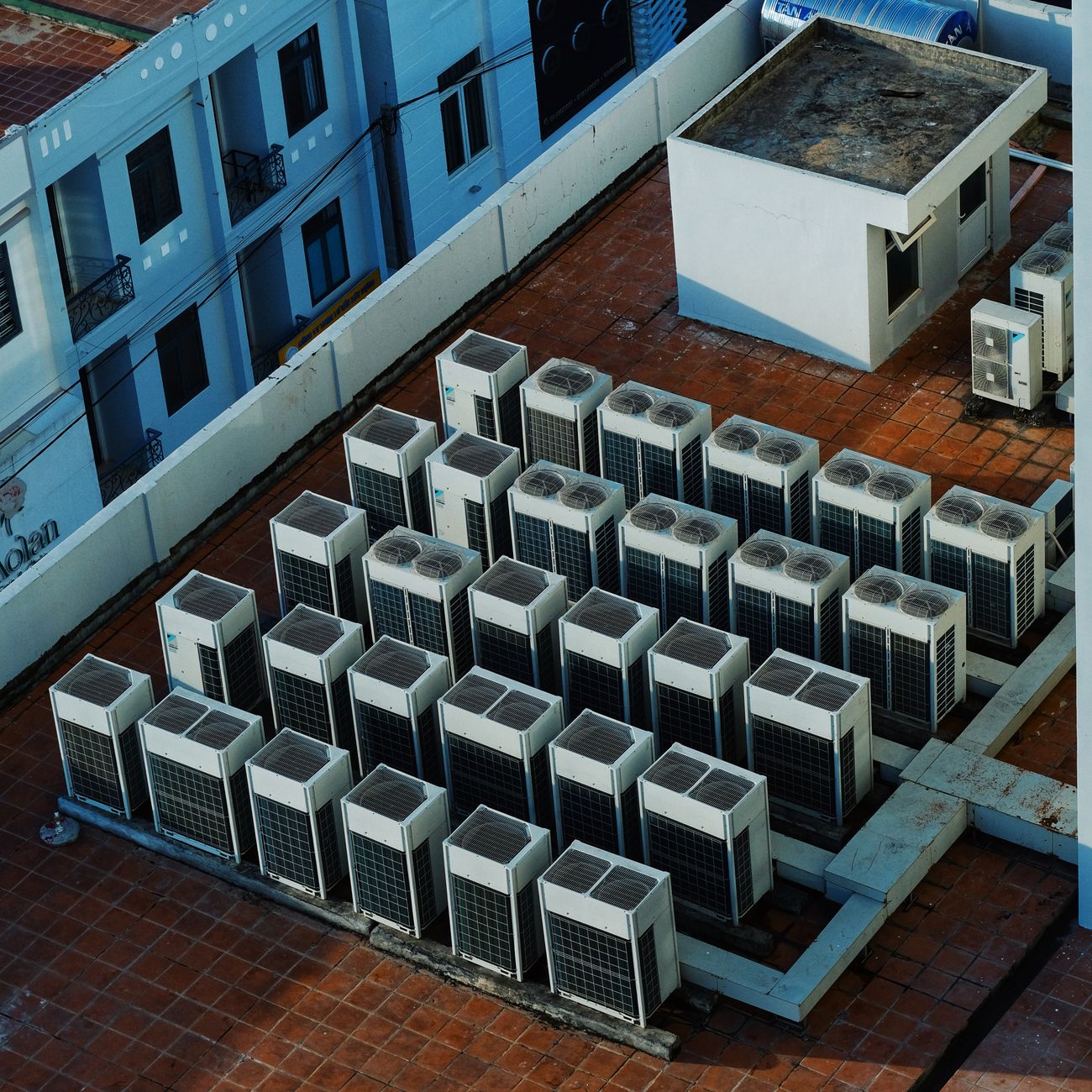 High angle view of rooftop HVAC units on a building in Buon Ma Thuot, Vietnam.