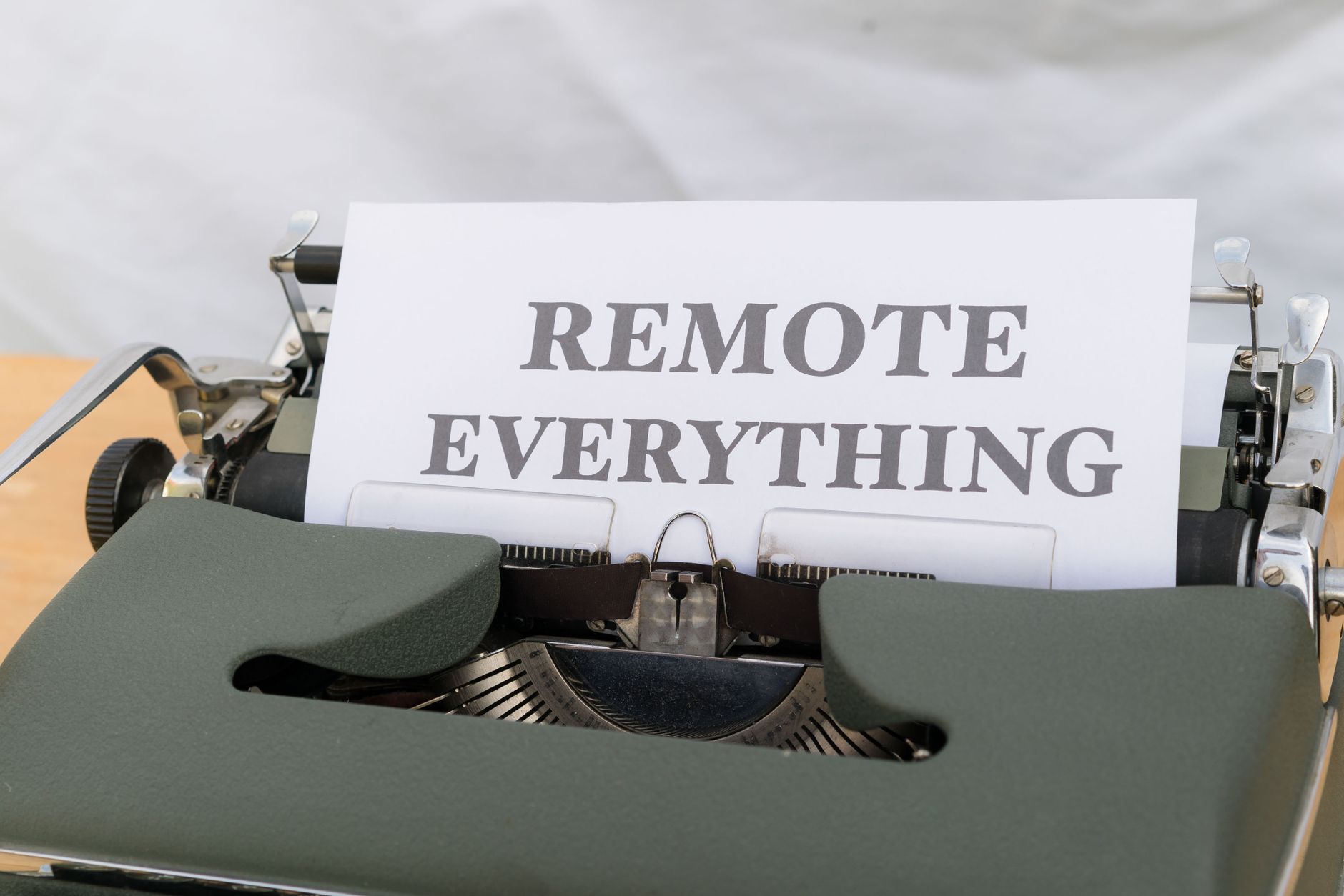 Typewriter with 'REMOTE EVERYTHING' message symbolizing digital transformation.