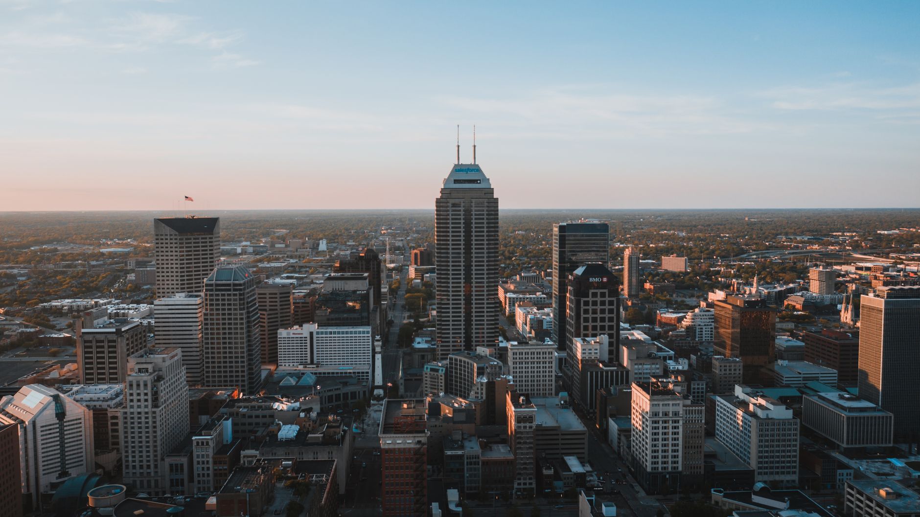 A breathtaking aerial view of the Indianapolis skyline at dusk, showcasing urban architecture.