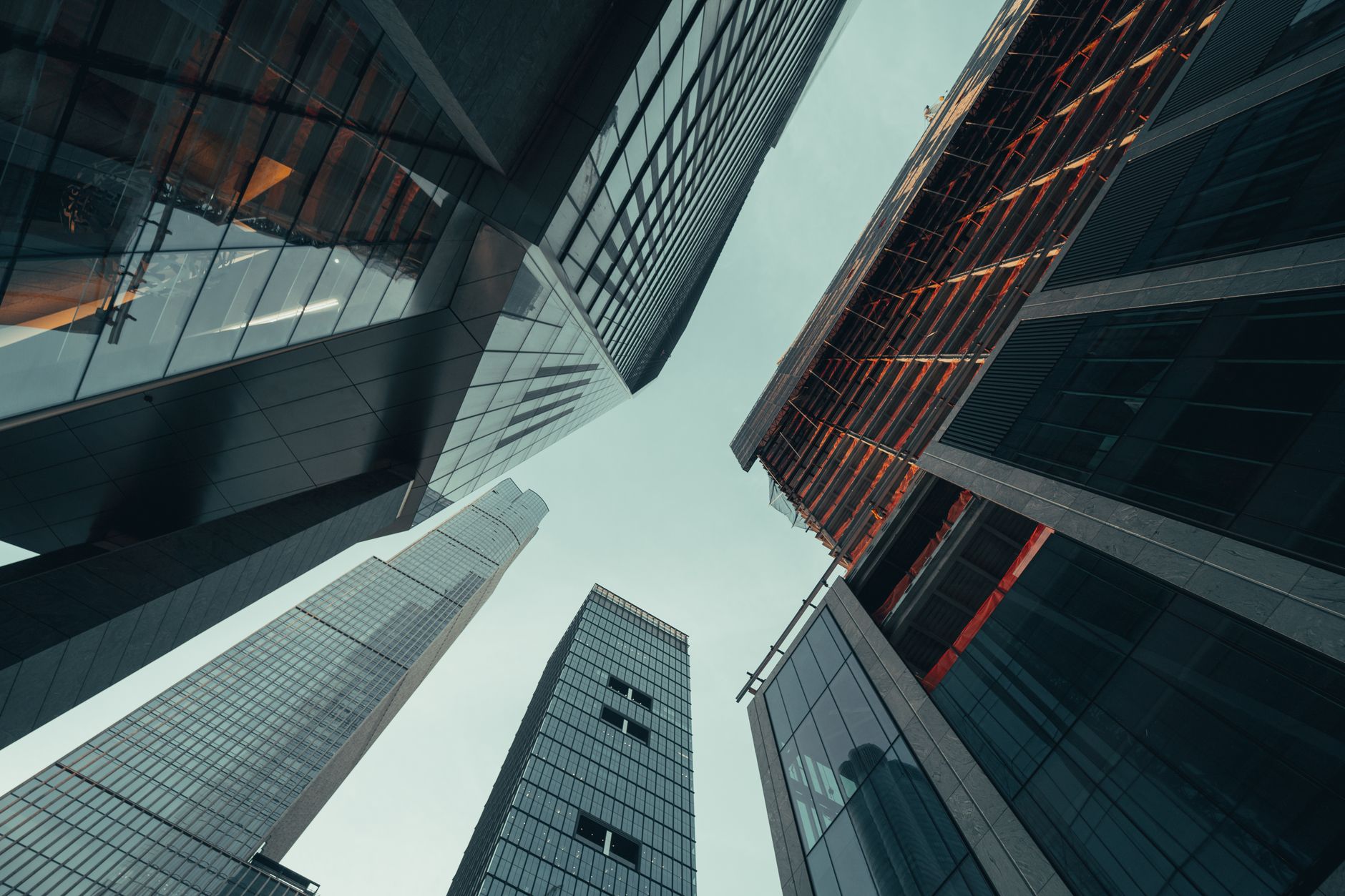 Low angle view of modern skyscrapers in New York City showcasing urban architecture.