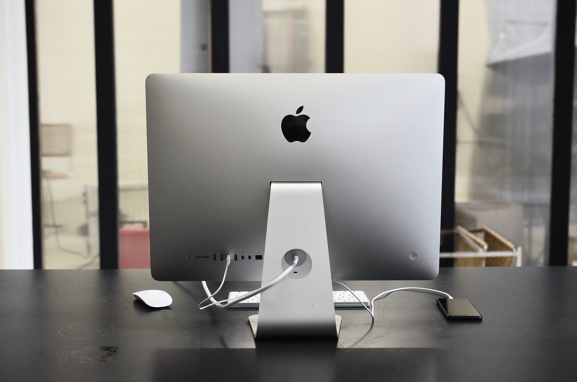 Contemporary convenient computer on table with mobile phone in office of business center