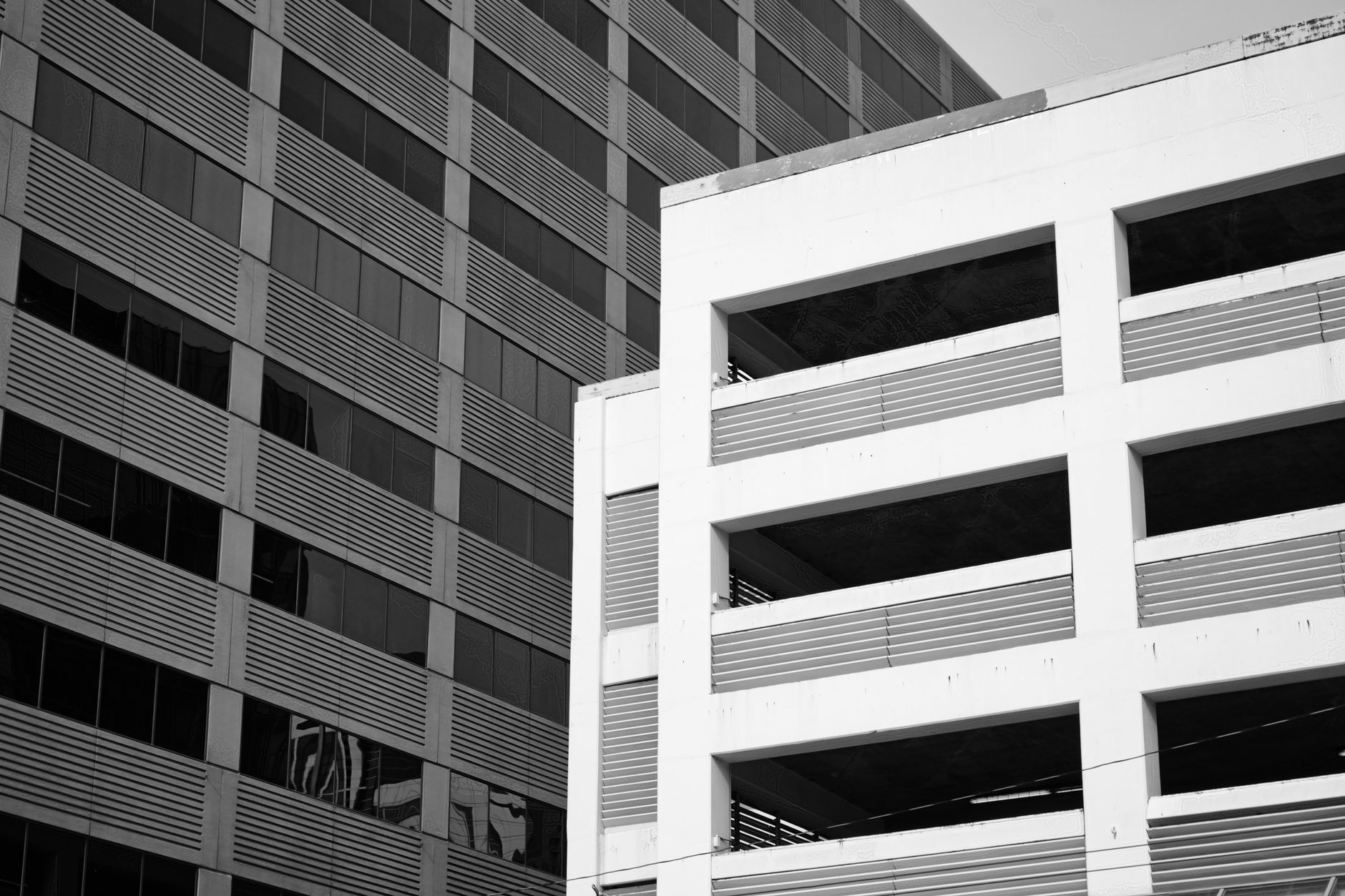 Modern city buildings in contrasting black and white design, showcasing urban architecture.