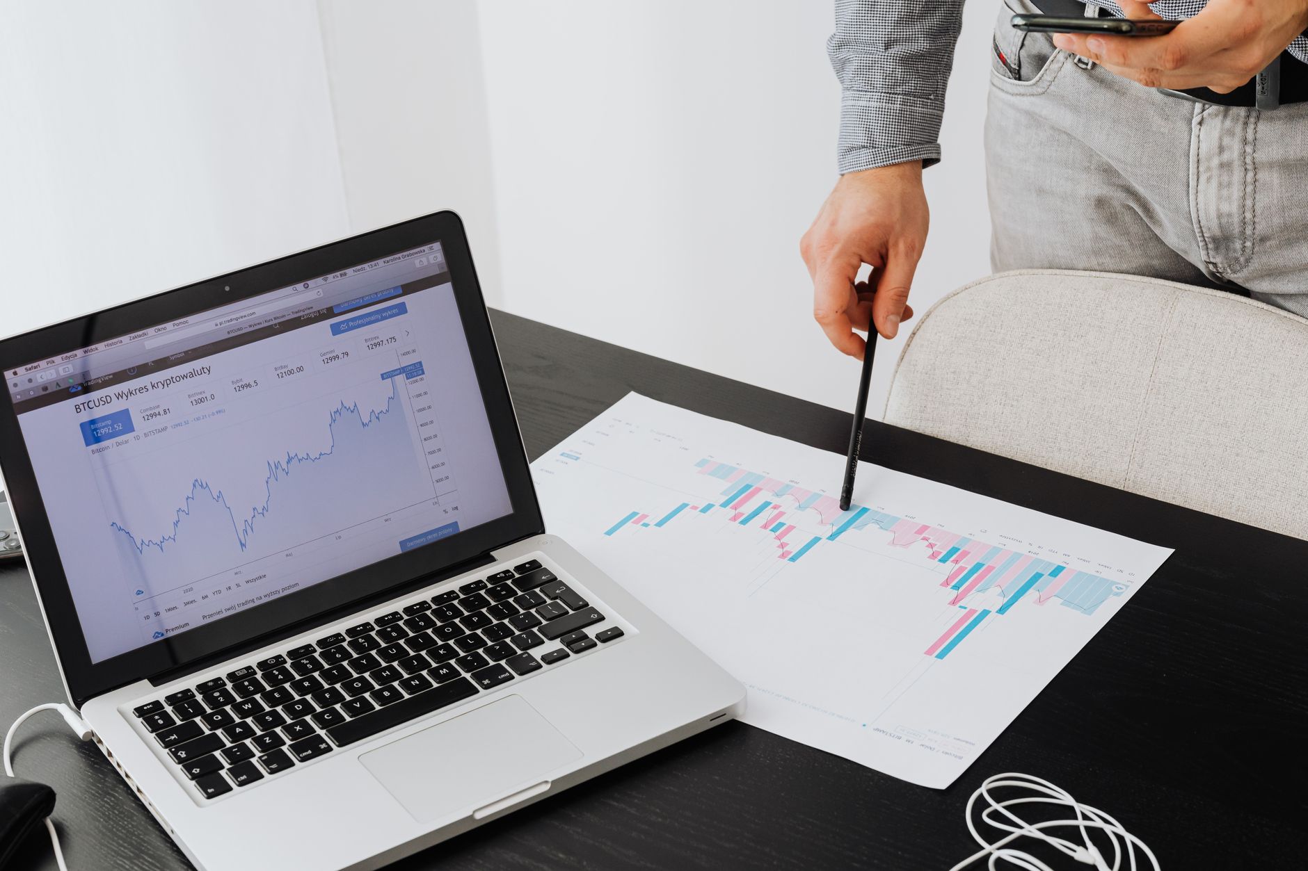 Person analyzing cryptocurrency data using a laptop, highlighting financial insights.