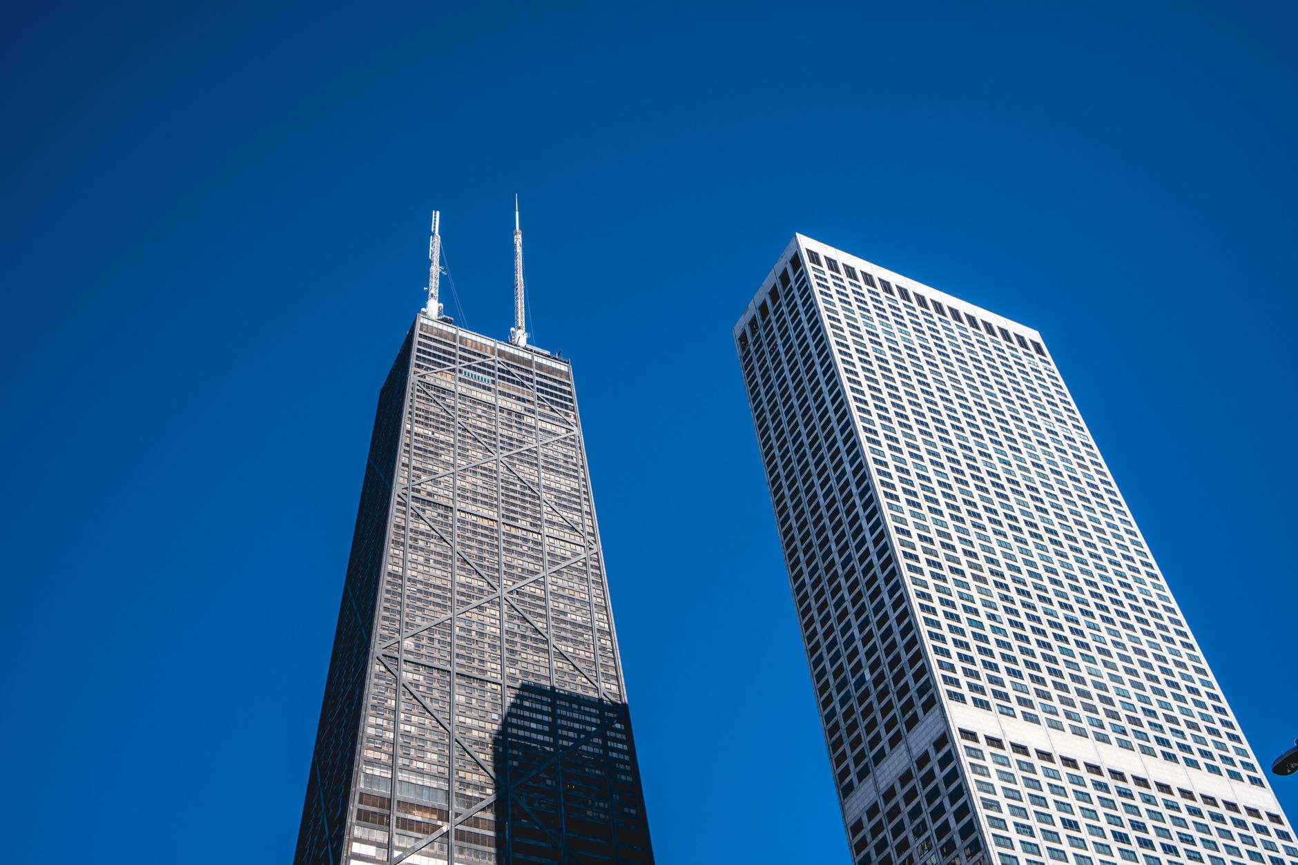 View of iconic Chicago skyscrapers with clear blue skies, featuring modern architecture.