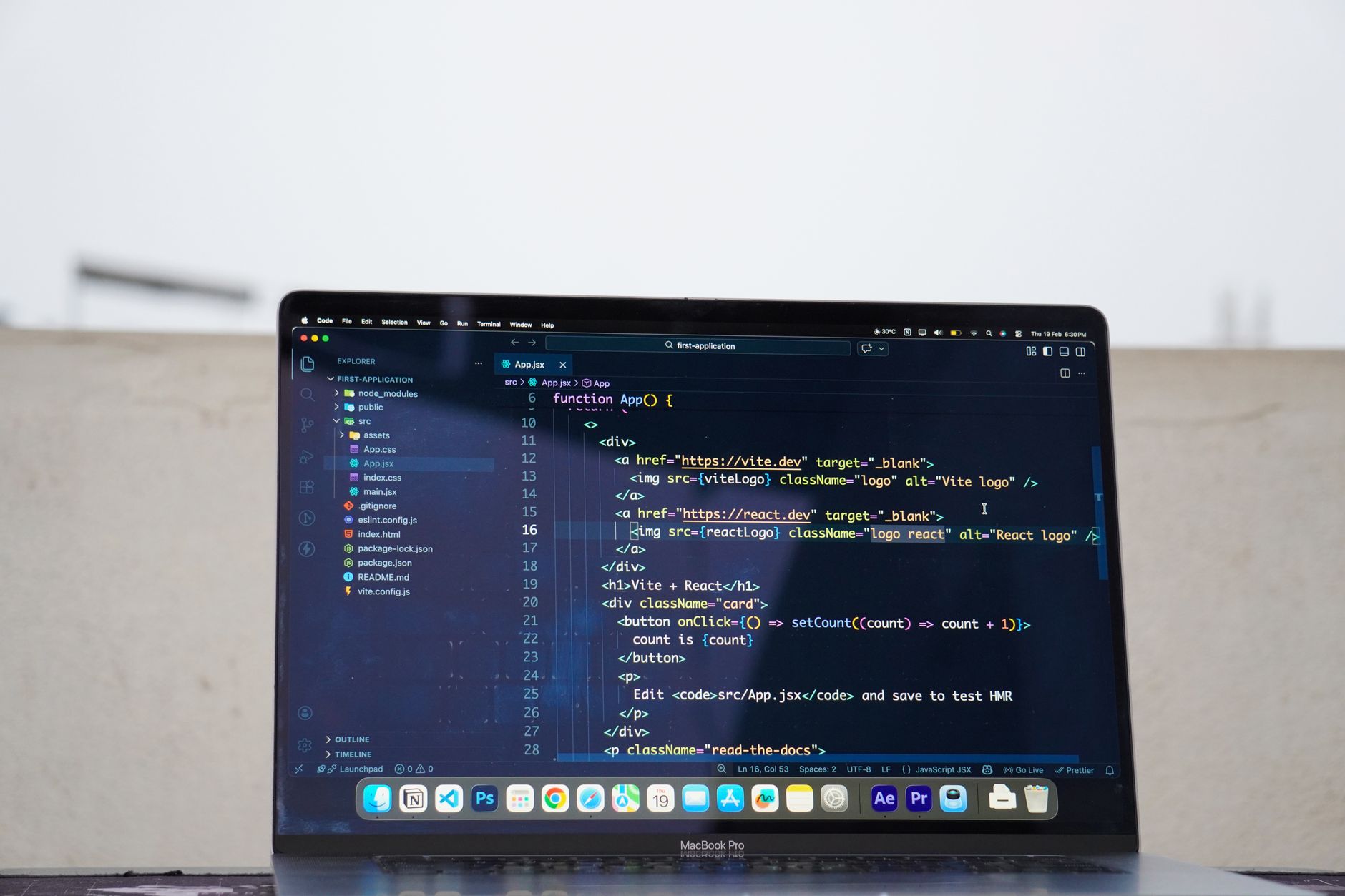 Laptop displaying code outdoors, ideal for remote work or freelance programming.