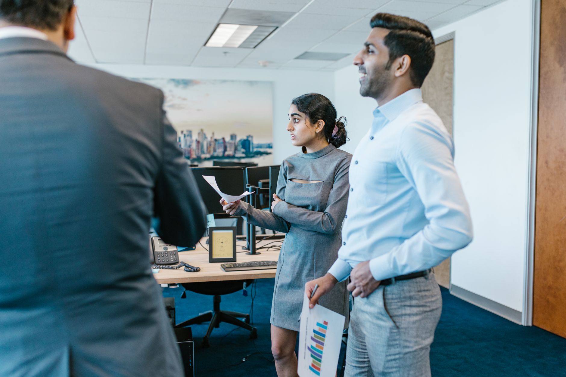 Diverse team discussing ideas in a bright office setting.