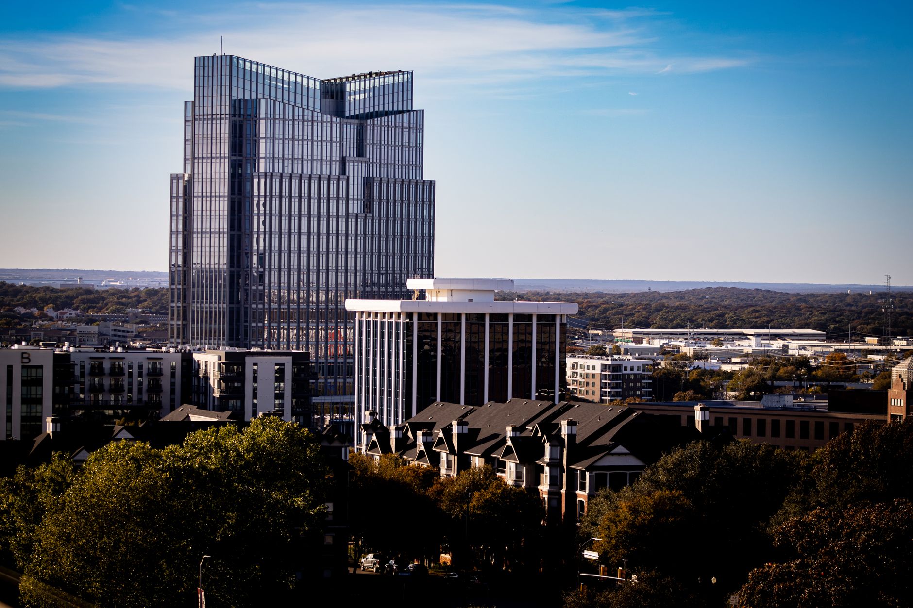 A view of Fort Worth's modern skyline with the prominent Frost Tower under a clear blue sky.