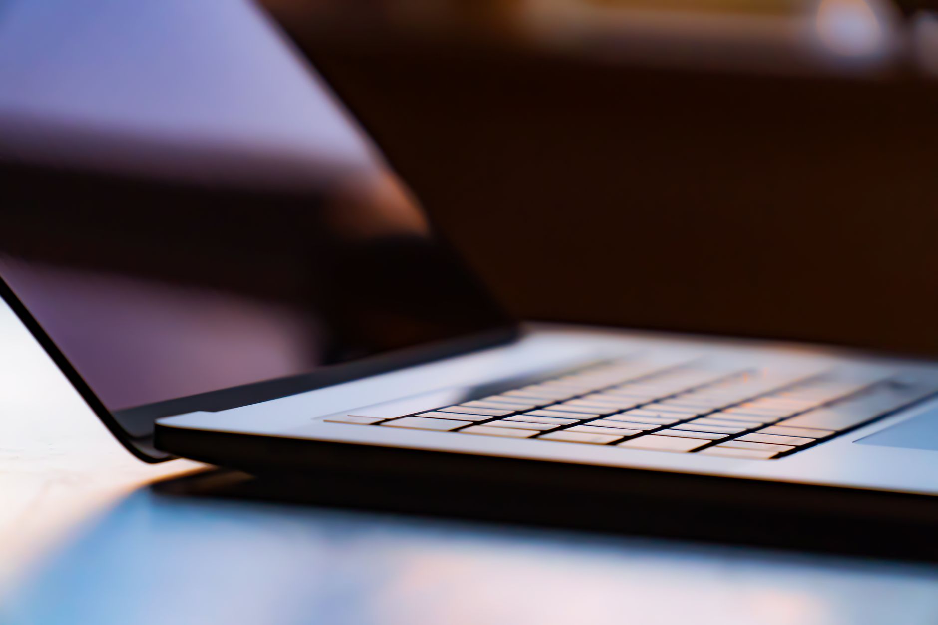 A detailed view of a laptop keyboard with shallow depth of field.