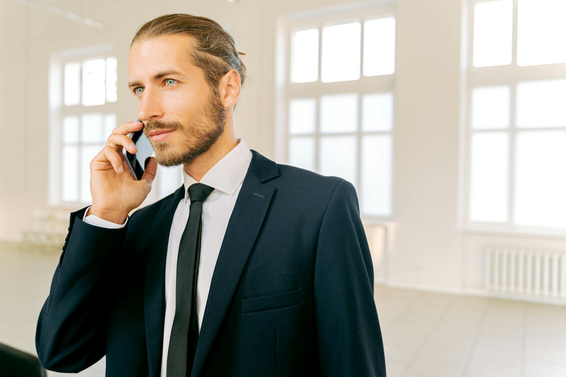 Busy professional handling calls in Tucson office