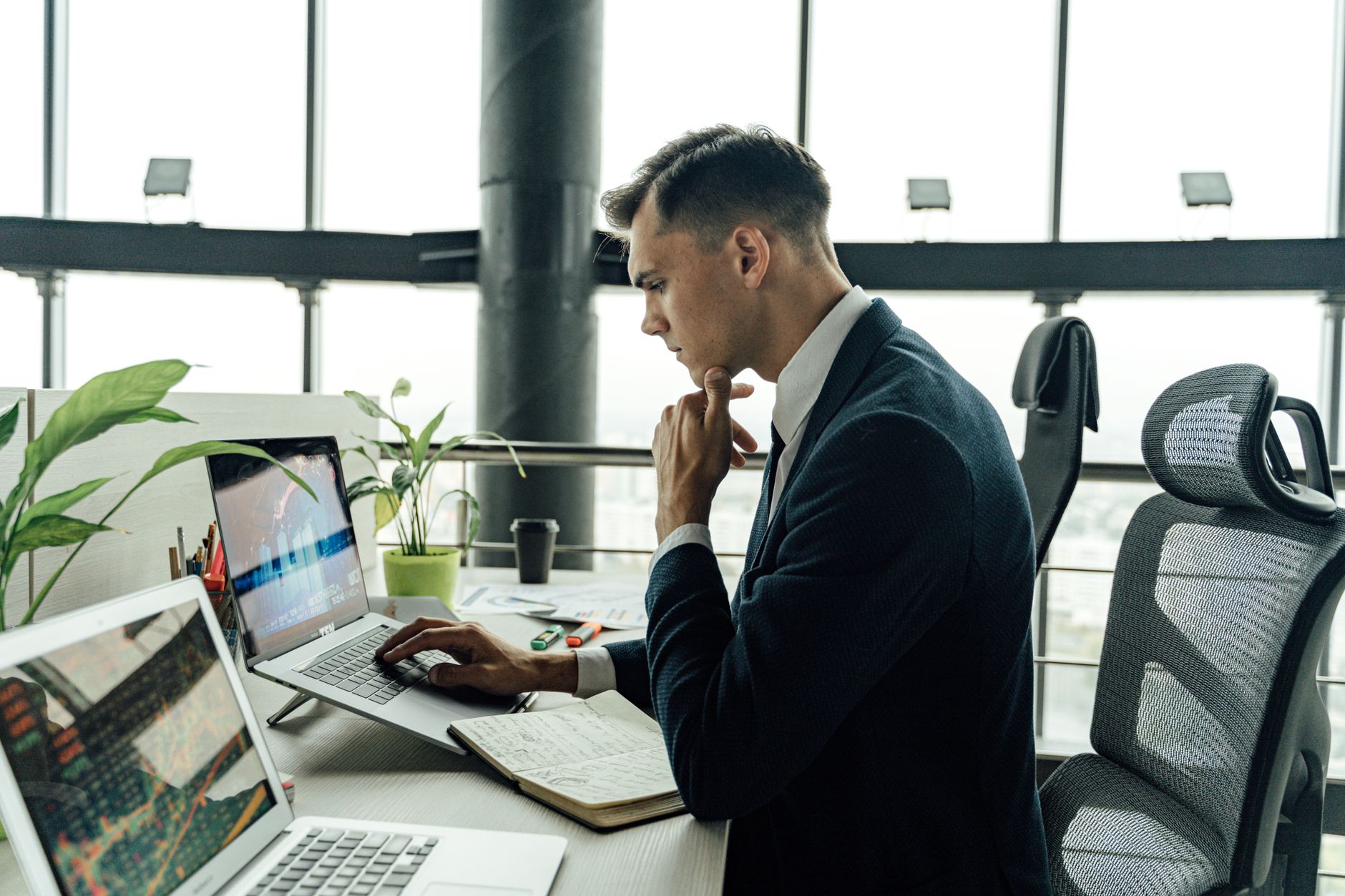 Professional services consultant analyzing CRM data on tablet