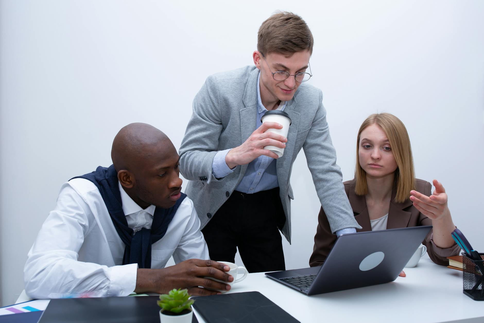 B2B team discussing account-based AI strategy in modern meeting room