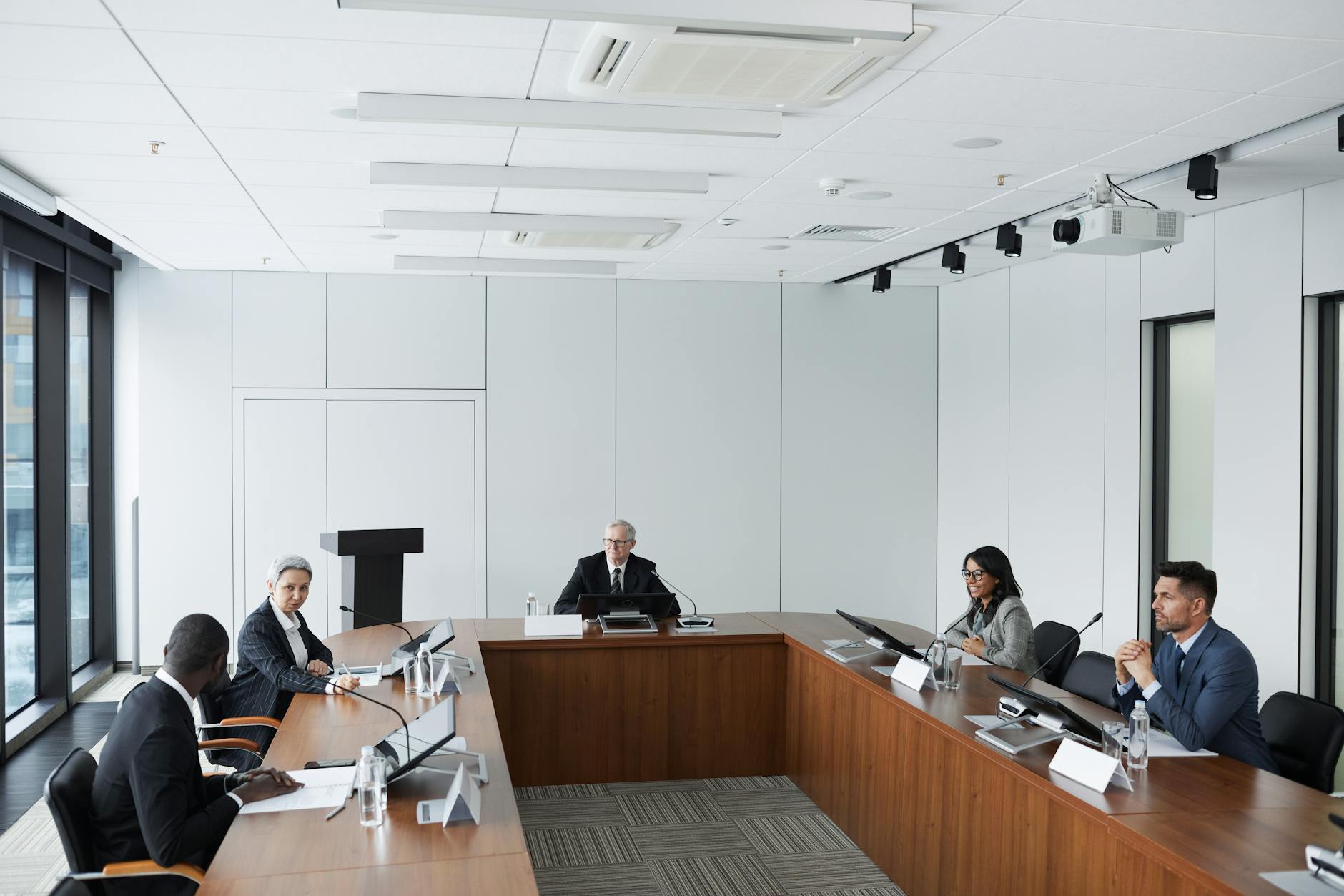 Executives discussing AI regulations in boardroom