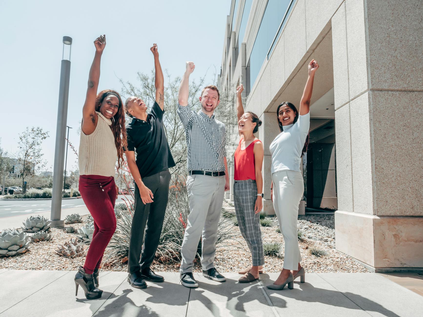 Sales team celebrating achievement of sales quota