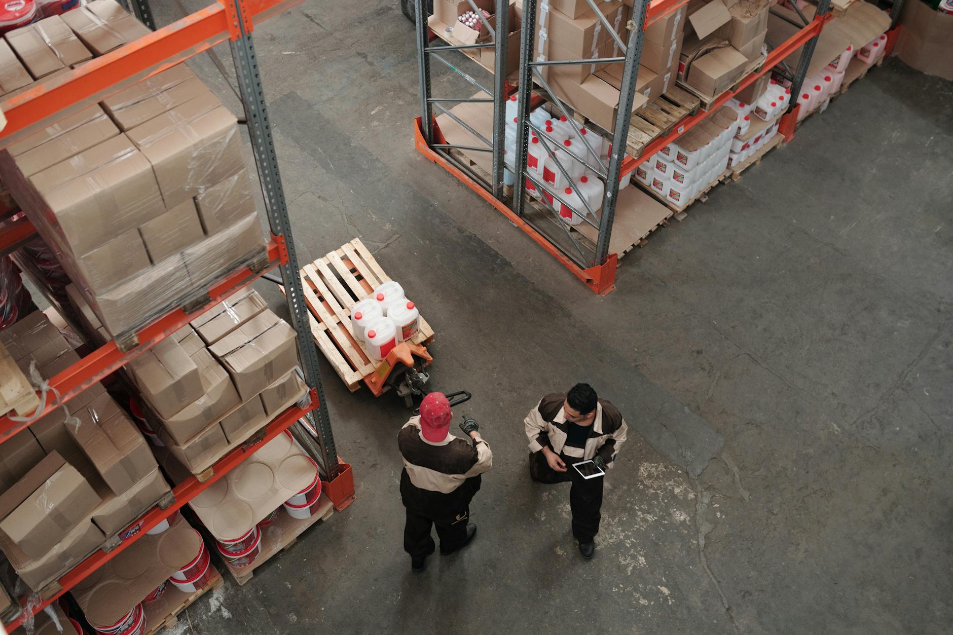 Detroit factory workers analyzing data on CRM tablets