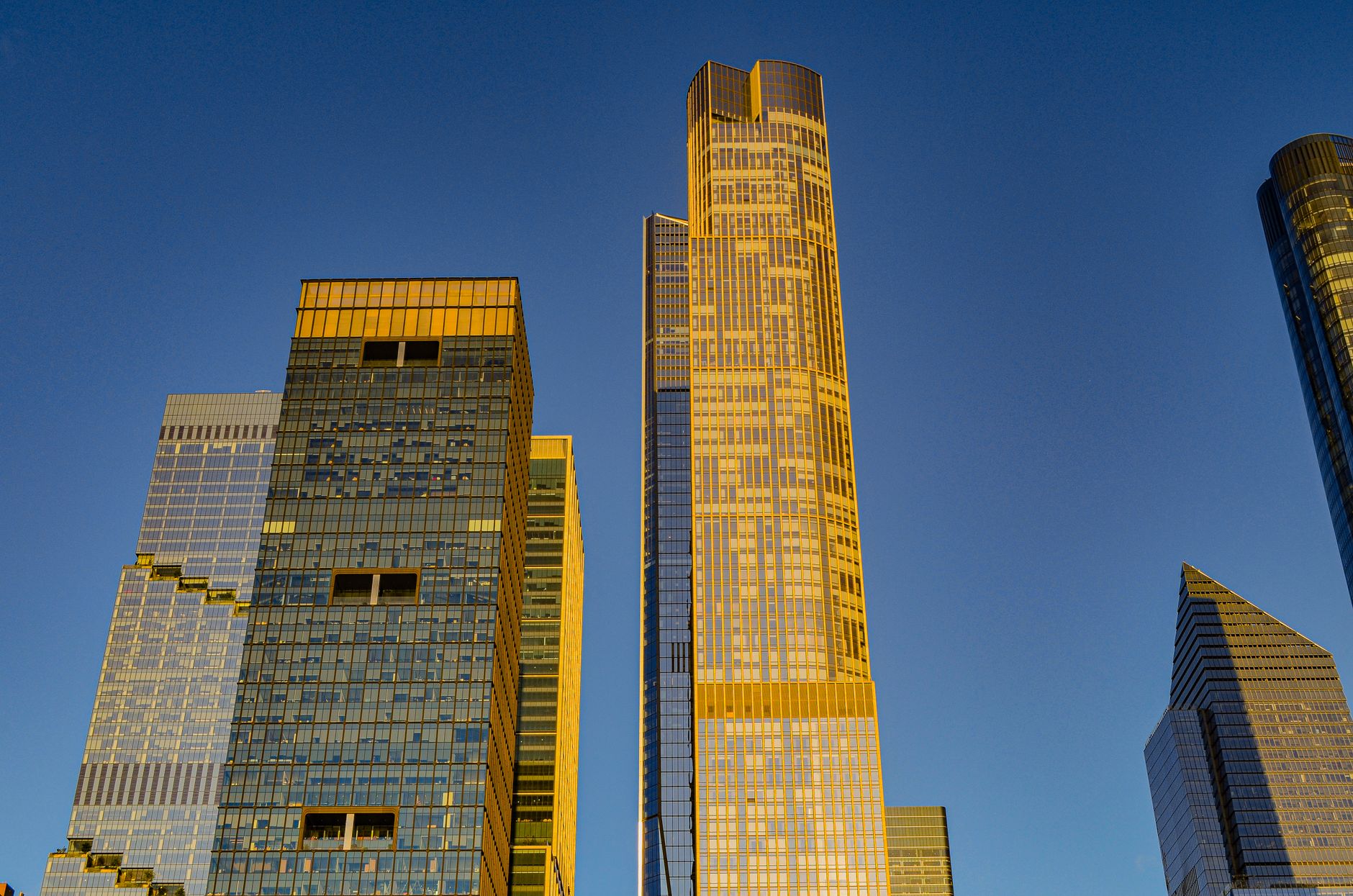 Financial district professional reviewing live market data on dual monitors