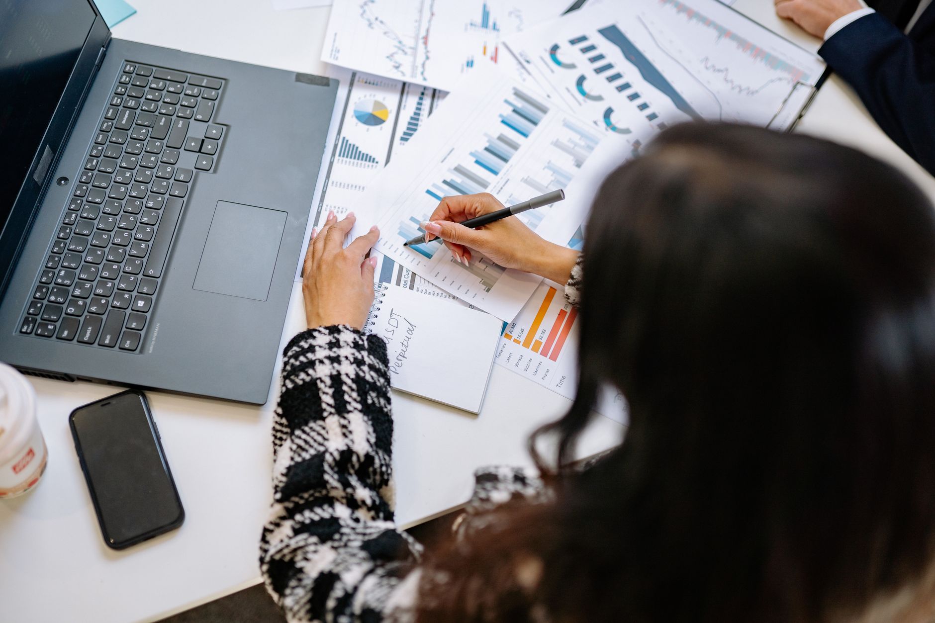 Business professionals analyzing sales data in a modern office