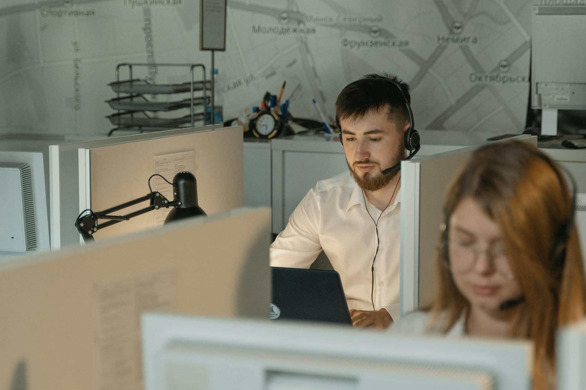 Busy Phoenix office receptionist handling phone calls