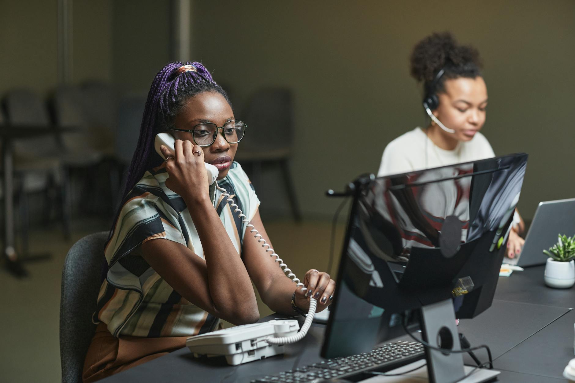 Busy New Orleans receptionist handling multiple calls