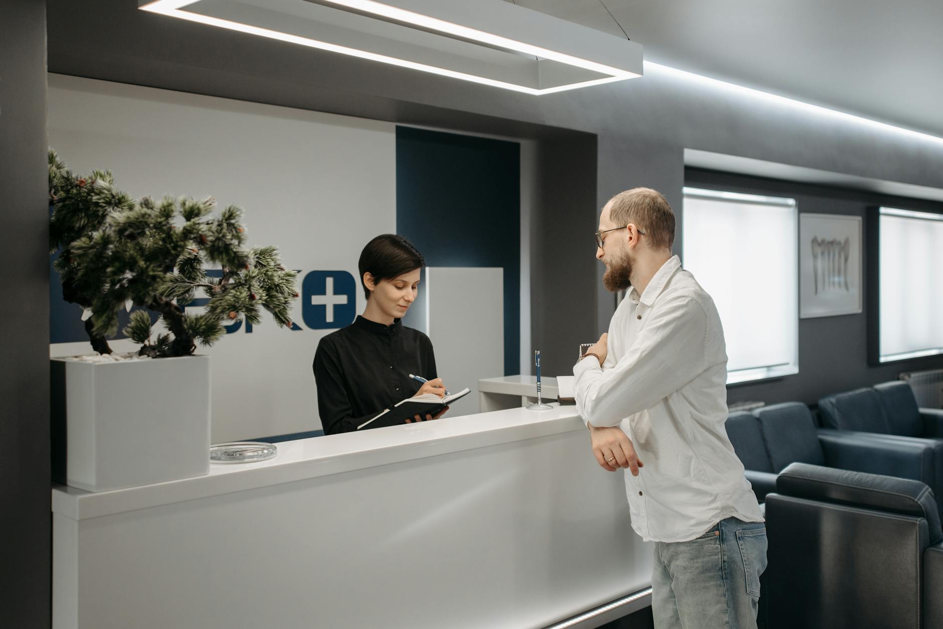 Modern office with receptionist desk and Raleigh skyline view