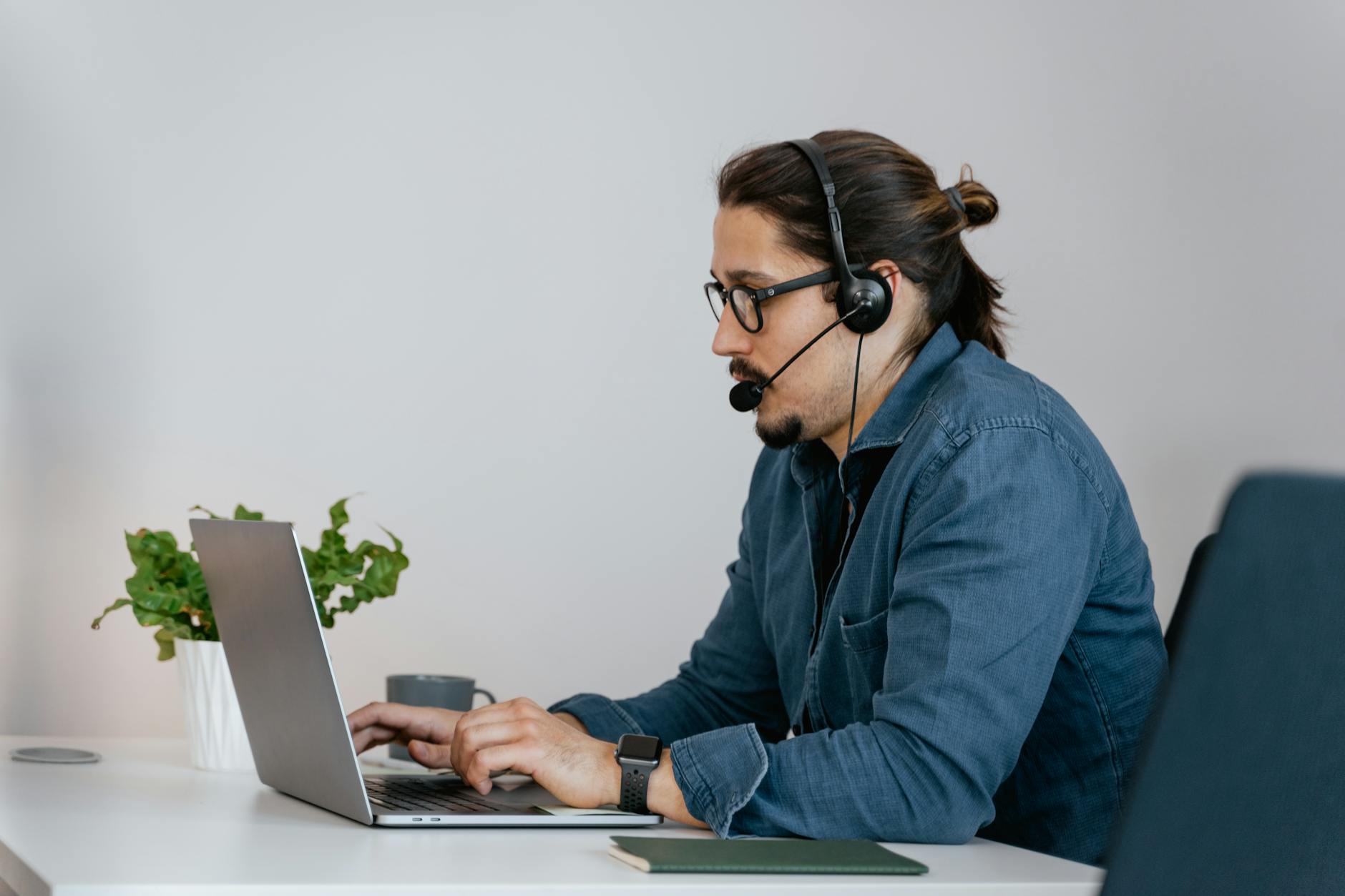 Real estate agent accessing cloud CRM dashboard on laptop