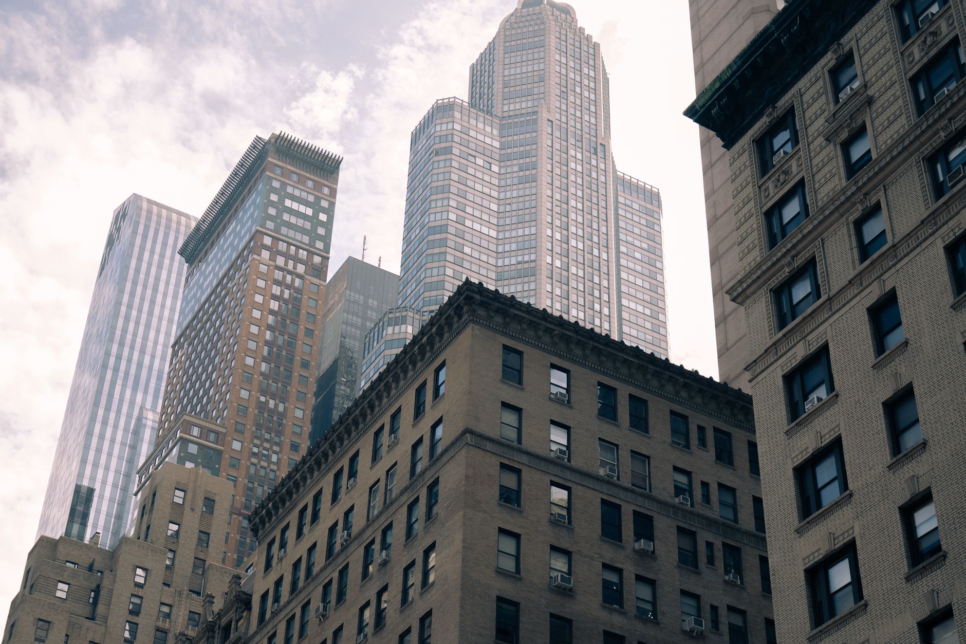 New York City skyline with business professionals in a modern conference room