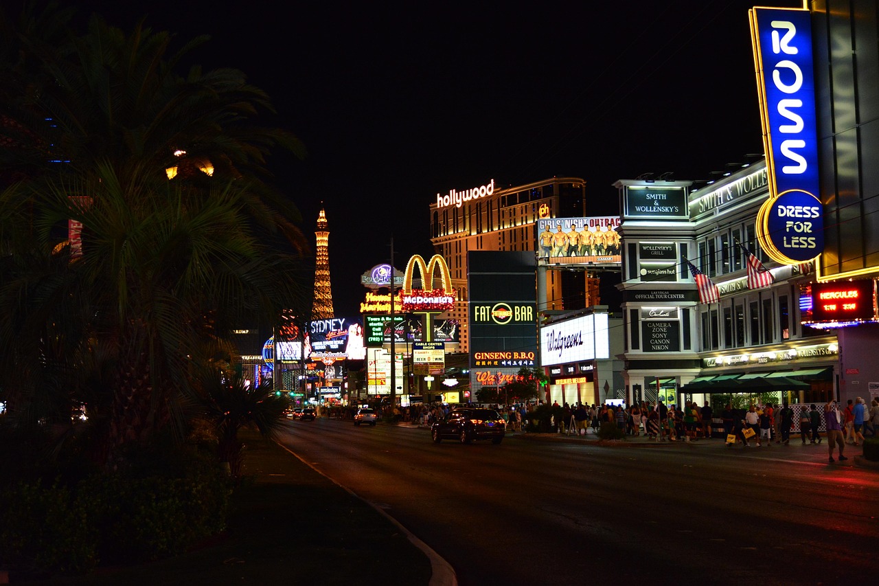 Busy Las Vegas casino floor at night with customer service desk