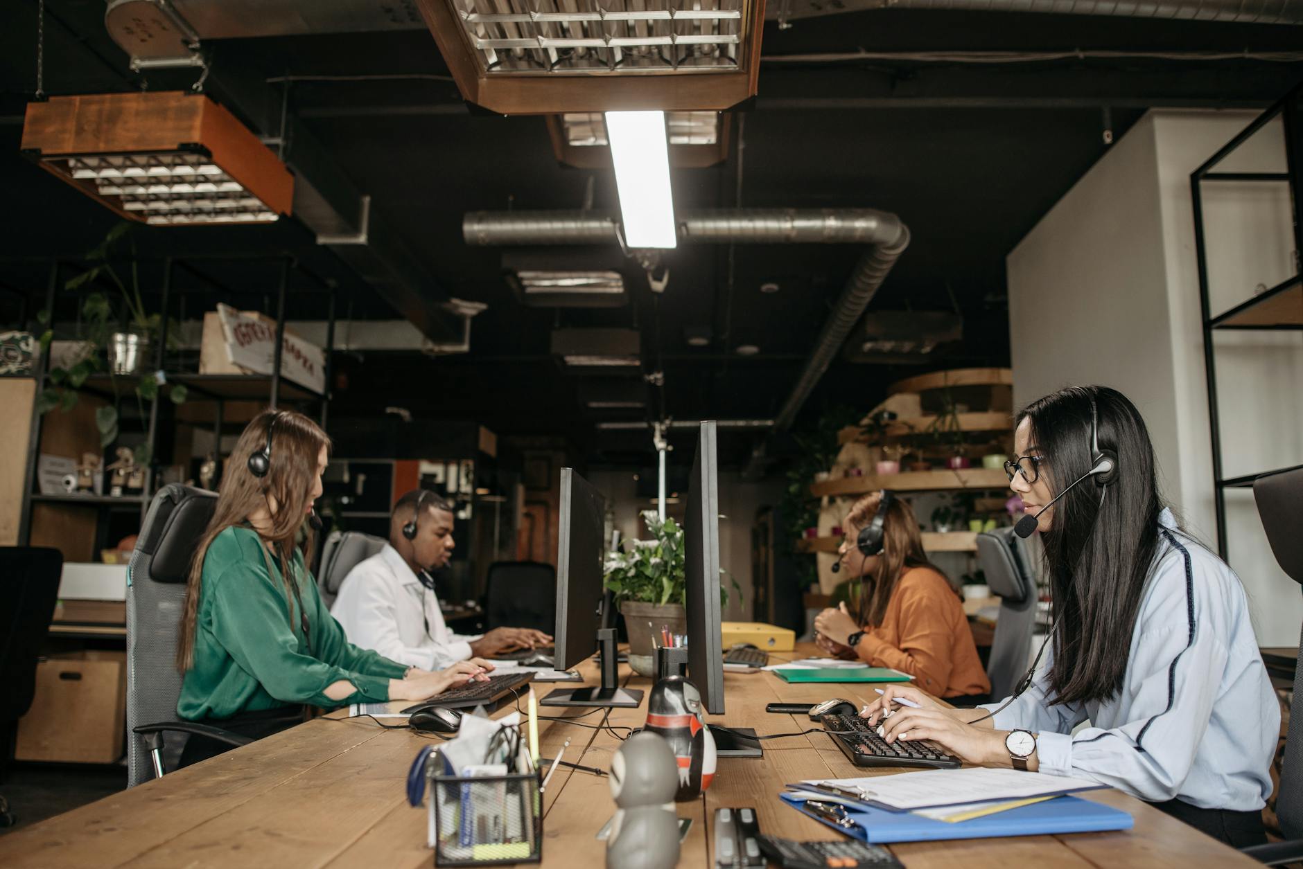 Sales team monitoring AI dashboard in Louisville office