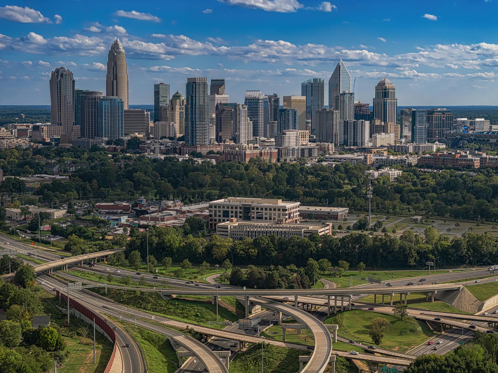Charlotte skyline with business professionals in meeting