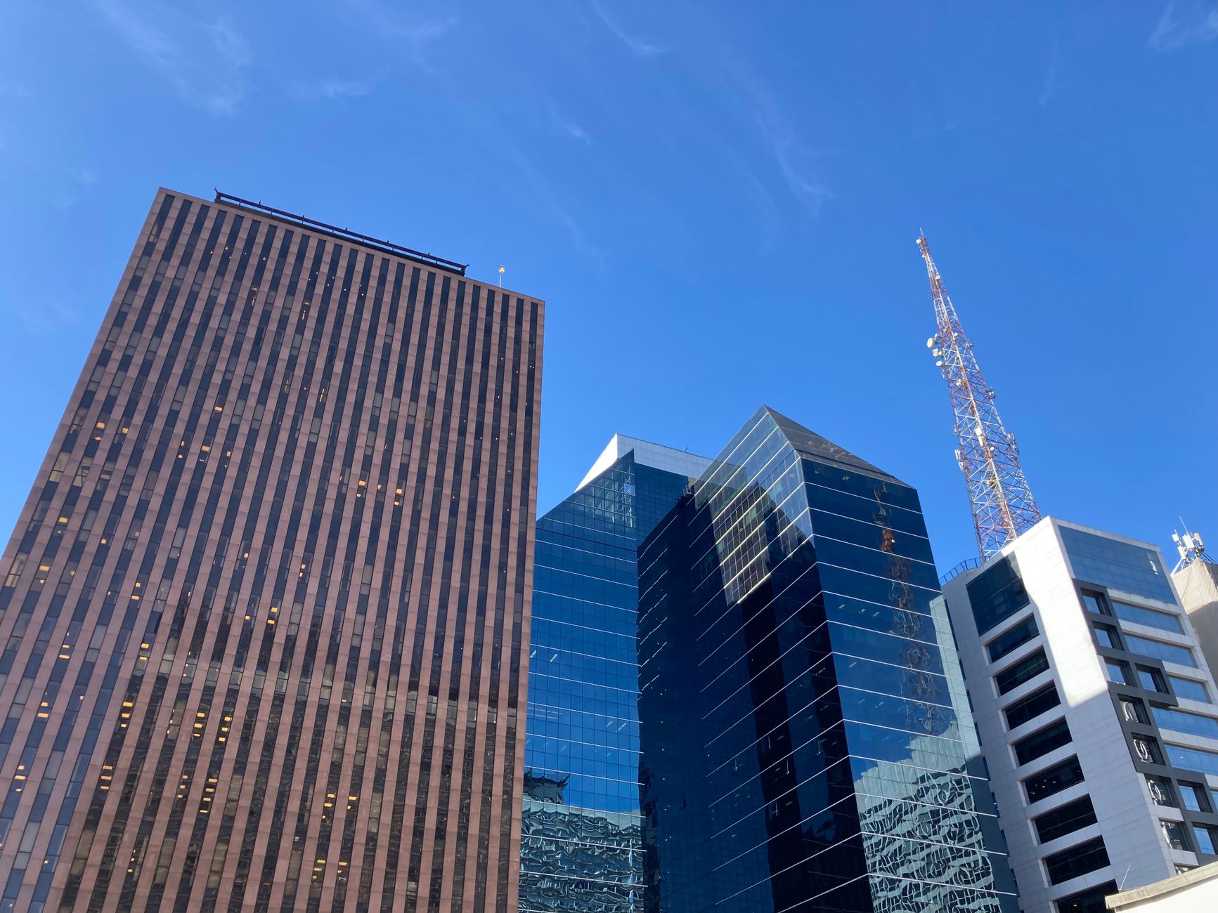 High-tech office space in downtown Austin with sales team analyzing data on screens