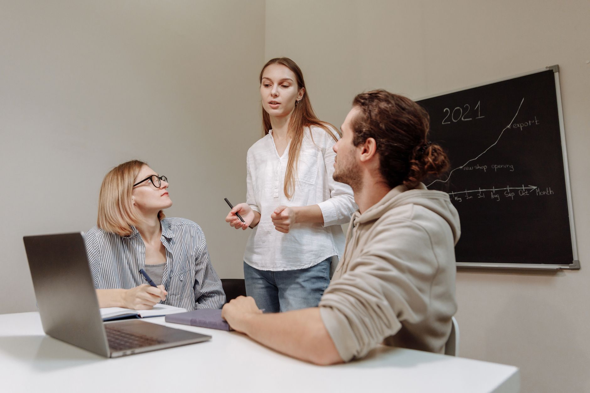 SEO agency team planning strategy on whiteboard