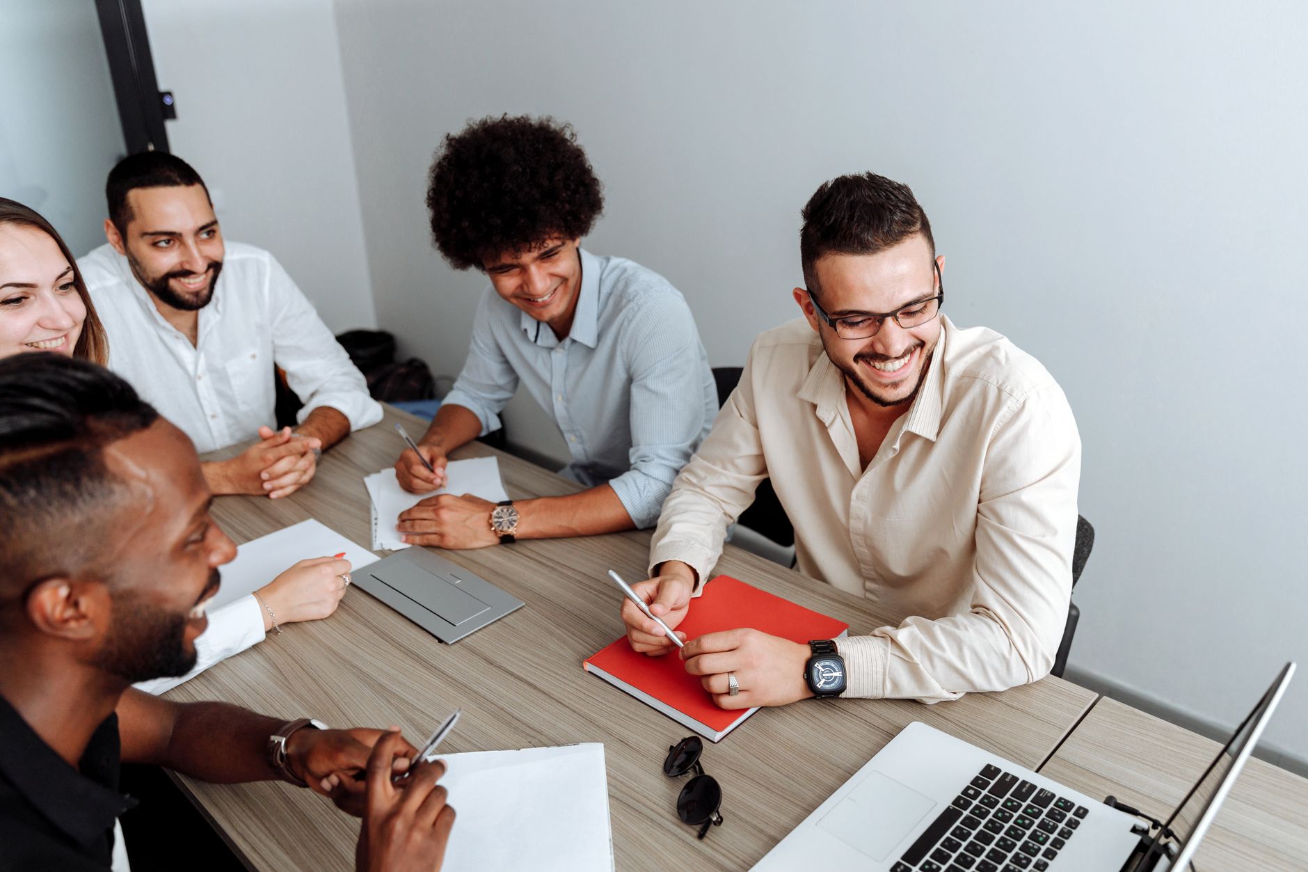 Indianapolis sales team in a modern office meeting