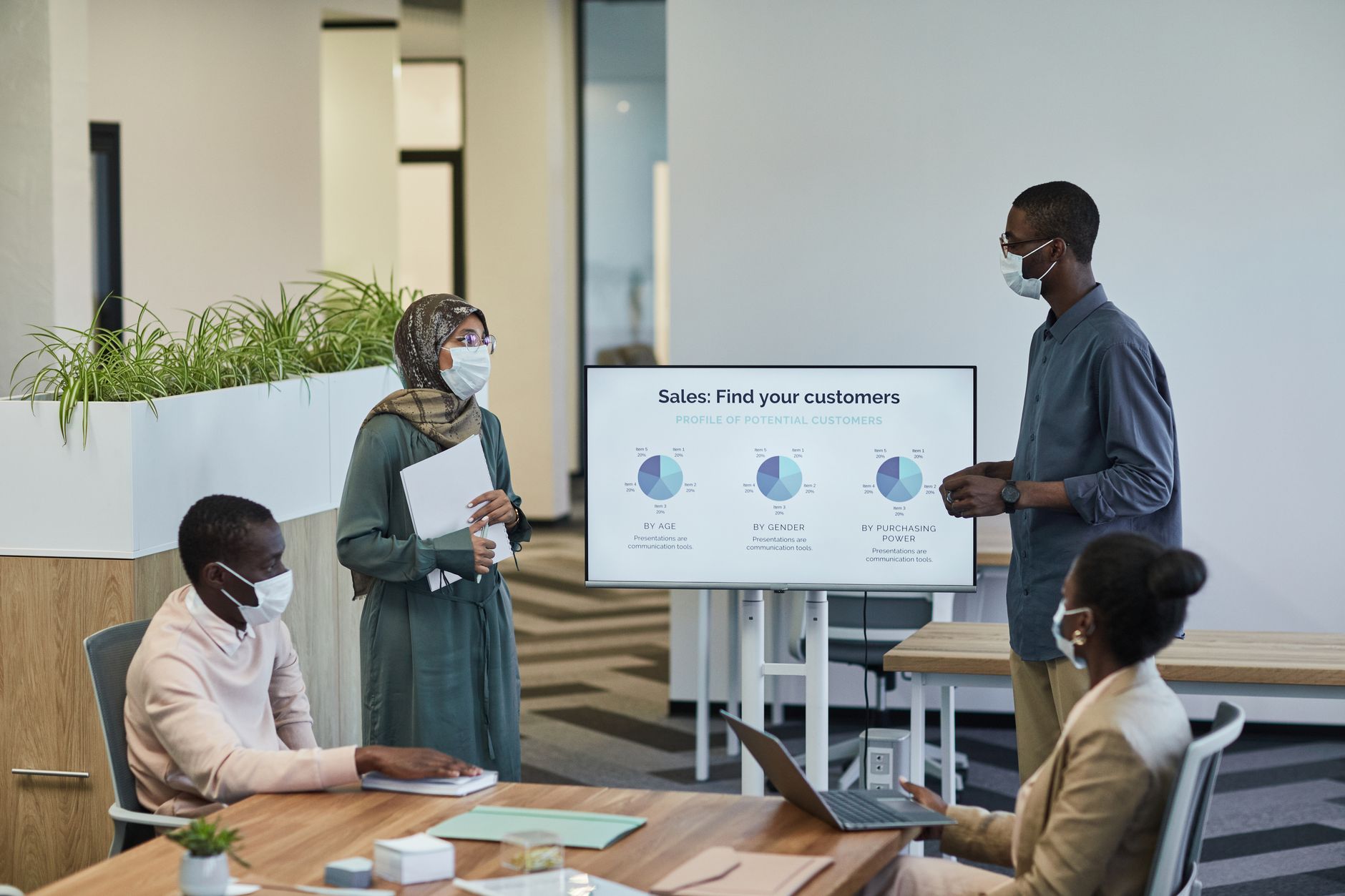 Sales team reviewing AI-generated leads on a tablet