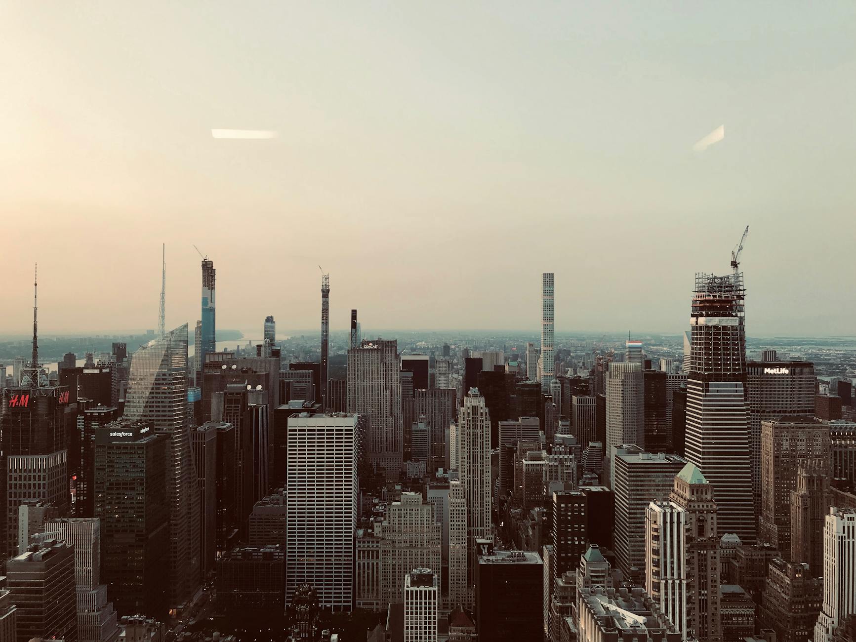 New York City skyline with business professionals in meeting