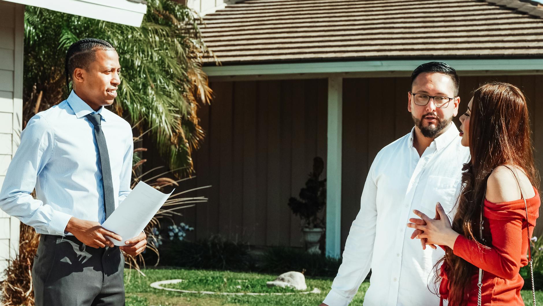 Roofer inspecting hail damaged roof