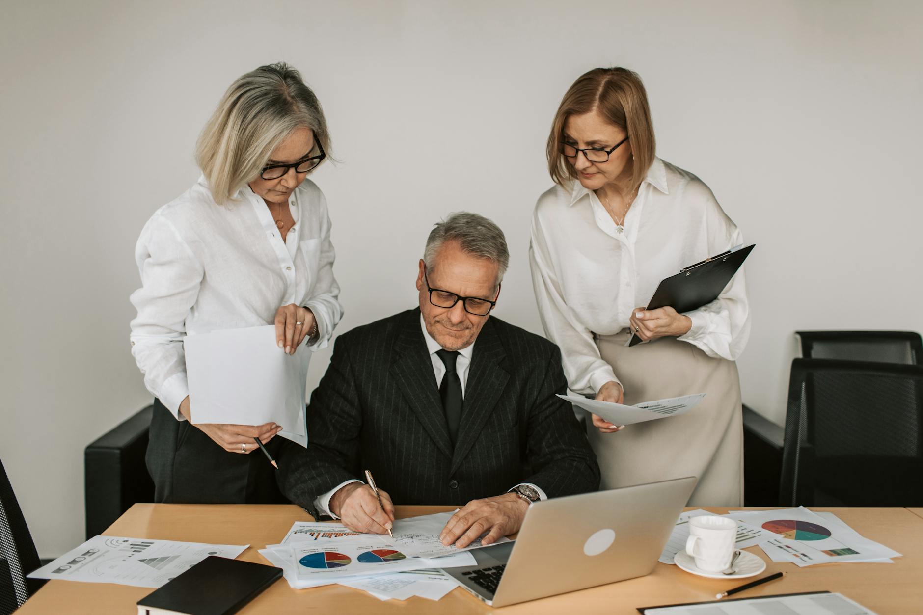 Business team analyzing sales charts in modern Oakland office