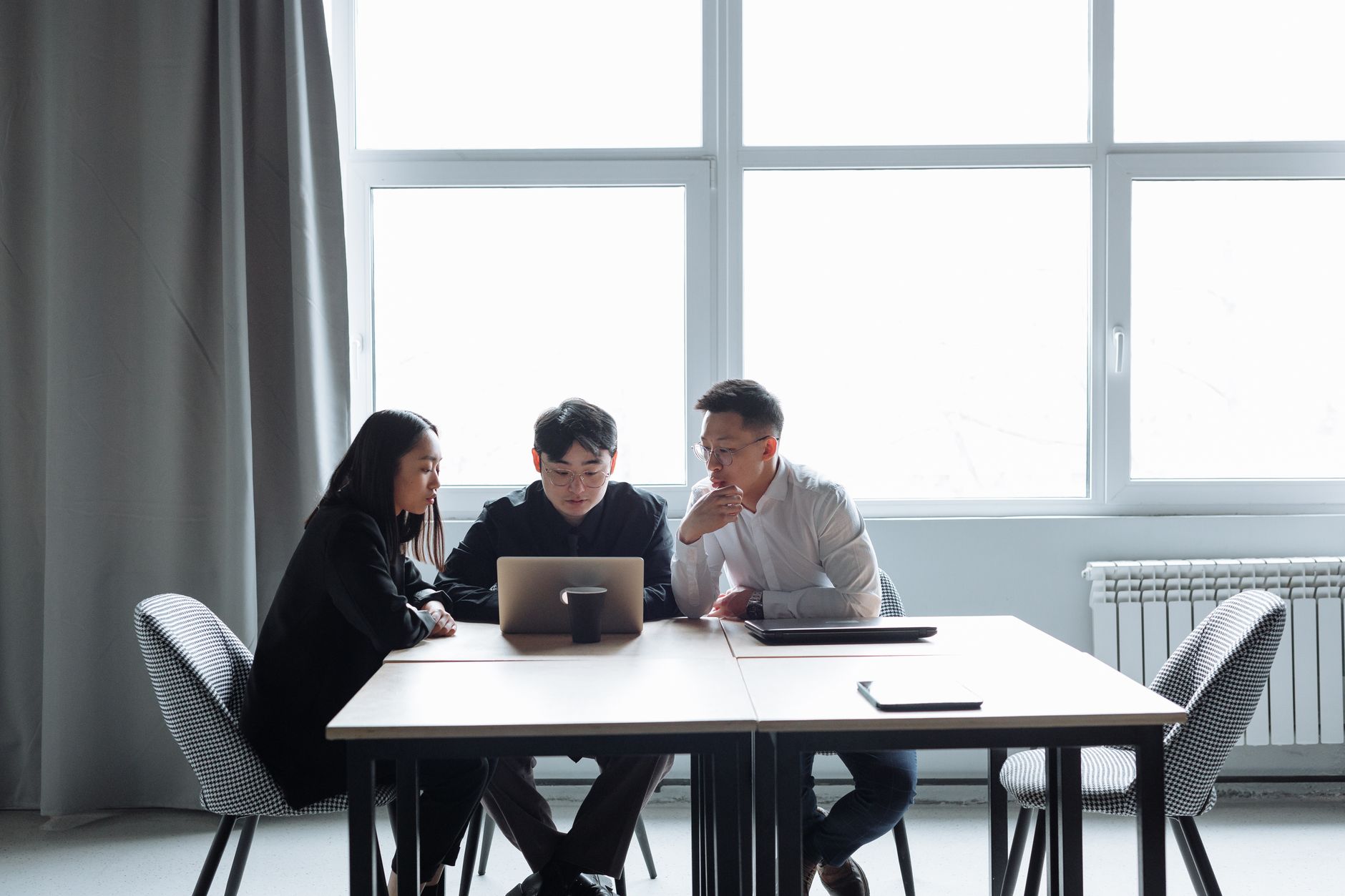 Business team analyzing AI regulation compliance documents