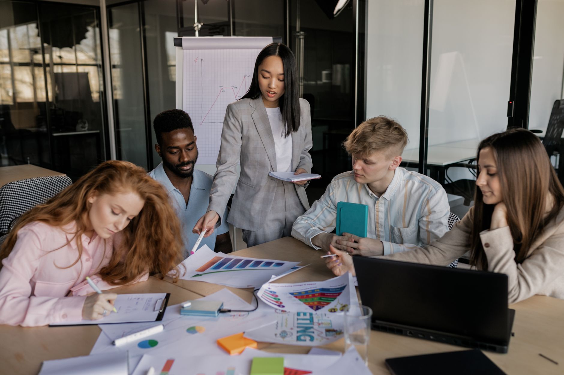 Sales and marketing team discussing AI setup strategy in a meeting room
