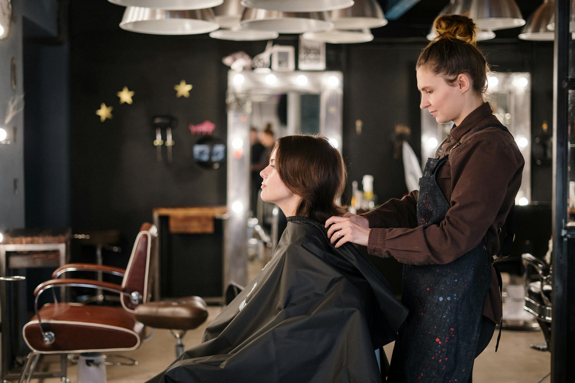 Busy hair salon with stylists serving clients