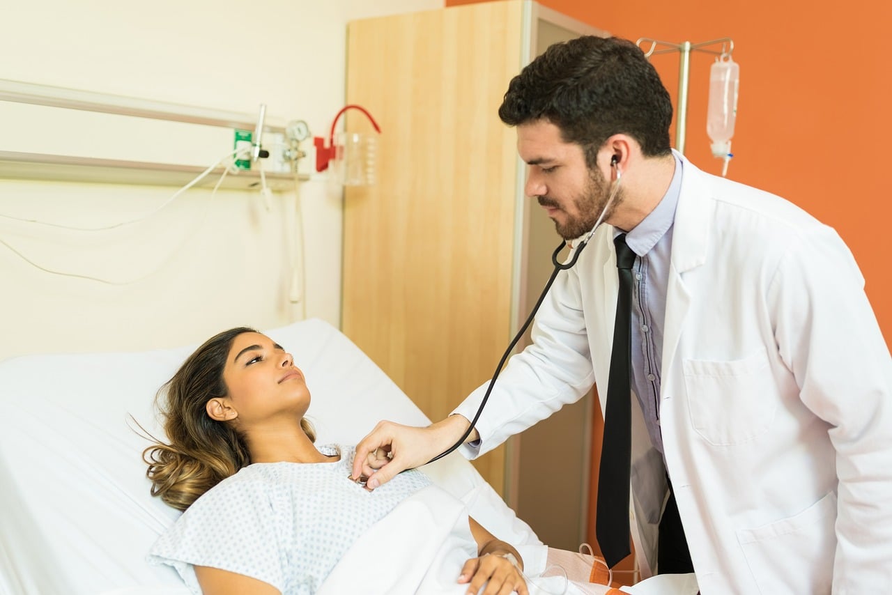 doctor, examining, patient, stethoscope, male, female, healthcare, worker, standing, hospital, sick, medicine, lifestyle, bed, health care, occupation, resident, treatment, teamwork, illness, breathing, indoors, two, people, young